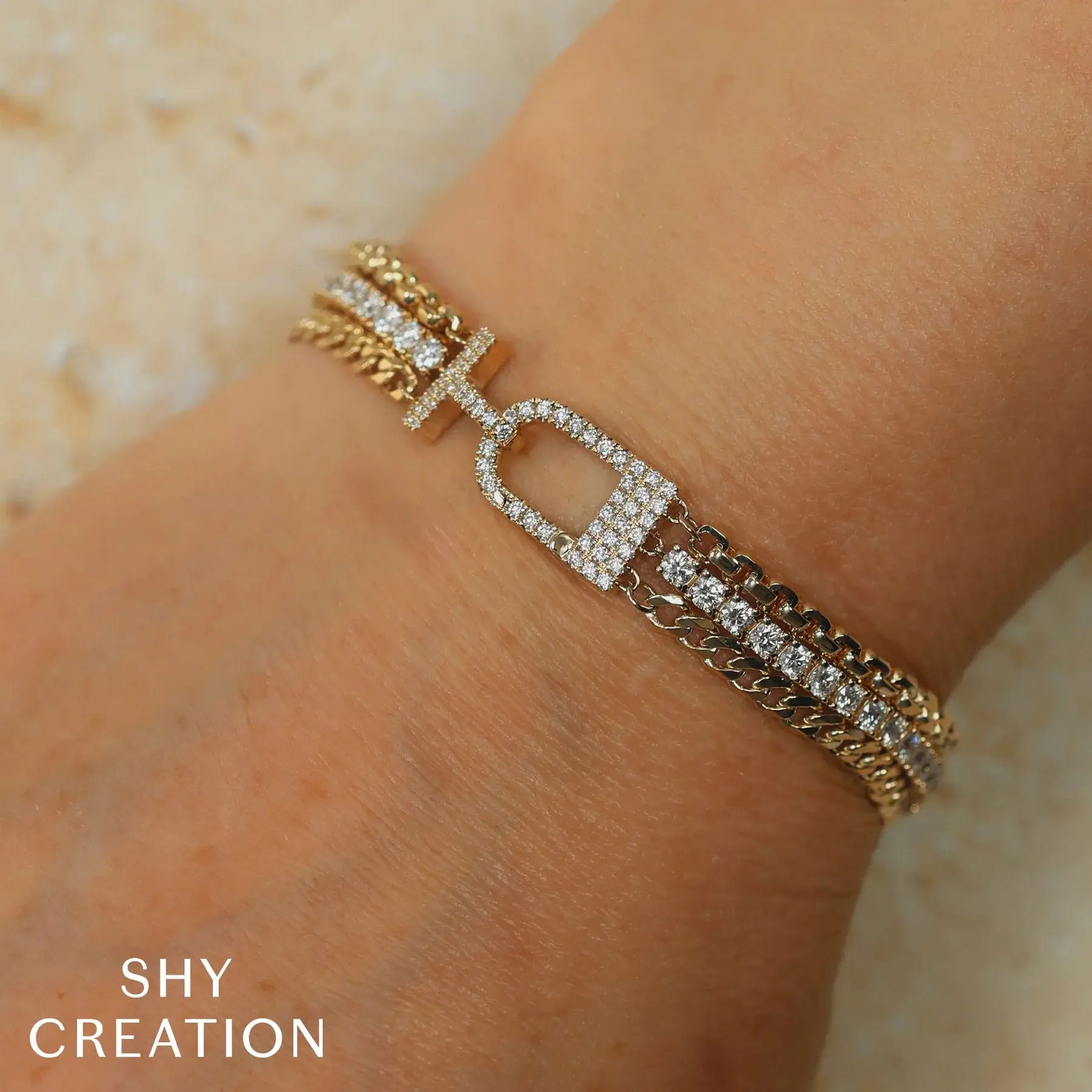 With its bold design, this piece commands attention and invites conversation at any event. All Shy Creation diamonds are natural and hand-selected. All stones are unique and hand set. As a result, you can expect slight variations in the shade, hue, tint of the color stones and stone count.-14k Yellow gold-Round diamonds, 3.9ctsItem# 808-2000180 Diamond Tennis Link Bracelet