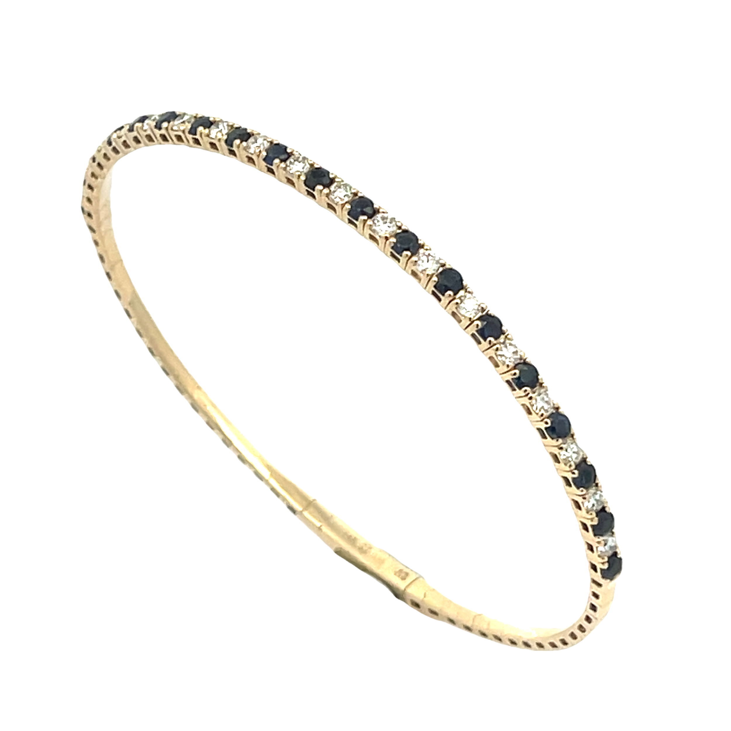 Featuring both blue sapphires and diamonds, this piece combines natural beauty in the form of a stunning fashion bracelet, effortlessly complementing any style.-14k Yellow gold-Round diamonds, 0.72cts-Blue sapphires, 1.12ctsItem# 240-2000013 Blue Sapphire & Diamond Flex Bracelet