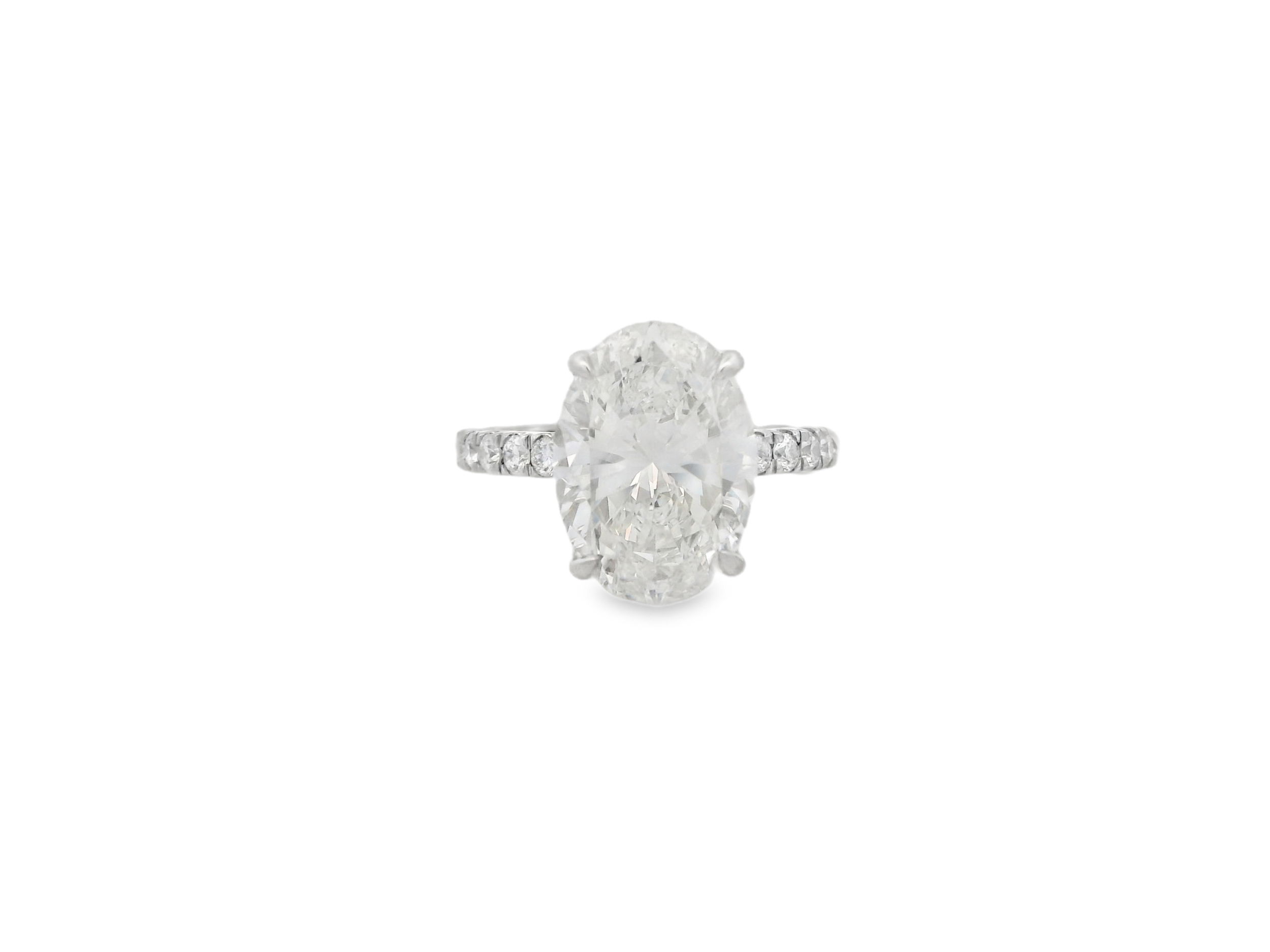 A stunning statement of love, this engagement ring showcases a breathtaking 5.01ct oval diamond at its center and set in Platinum. Timeless and elegant, the elongated silhouette enhances brilliance and creates a flattering, graceful look on the hand. A true showstopper for a once-in-a-lifetime moment.-Platinum-Oval diamond, 5.01cts-Round diamonds, -Size 5.5, Contact for sizing optionsItem# 100-2000029 Oval Engagement Ring