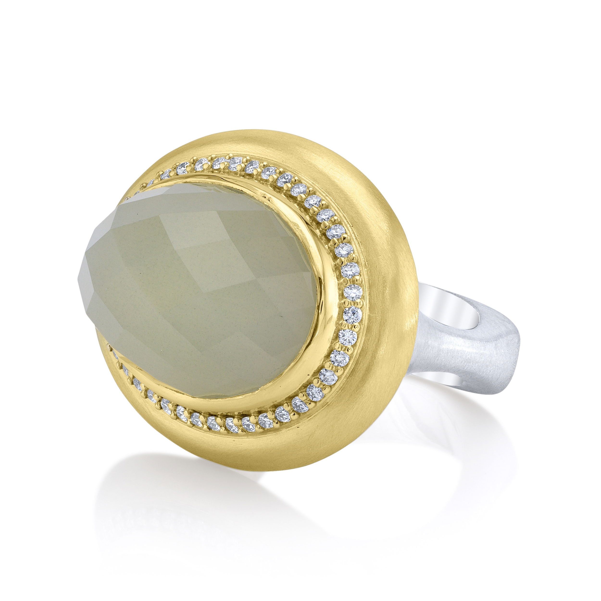 A faceted moonstone set in 18k yellow gold shines with soft, iridescent tones, complemented by sparkling diamonds. This ring adds a touch of elegance and subtle charm to any look.-18k Yellow gold-Faceted moonstone-Diamonds, 0.33ctsItem# ND-Ring-00012 Evé Ring