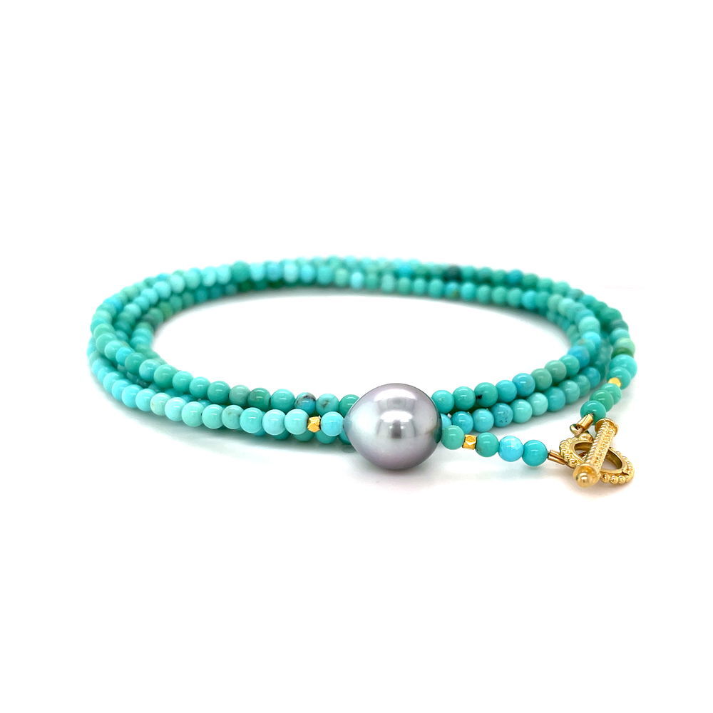 Crafted with vibrant turquoise beads, a single Tahitian pearl, and 18k yellow gold accents, this convertible wrap bracelet brings a fresh pop of color. Wear it as a bracelet or a necklace—either way, it's a standout piece with laid-back luxury. Pair with a pendant to elevate your style. Available in additional sizes and materials.-18k Yellow gold-Turquoise beads-Tahitian pearlItem# WRPTQ32 Turquoise and Tahitian Pearl Convertible Wrap Bracelet