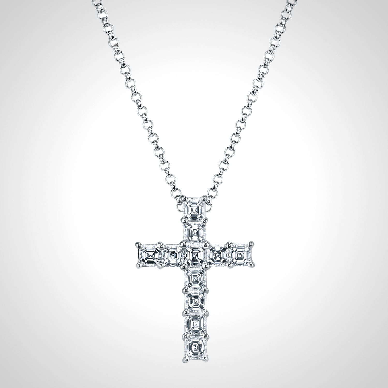 Crafted in 18k white gold, this cross necklace features Asscher-cut diamonds that reflect light from every angle. Clean lines and timeless sparkle give this piece a modern yet meaningful presence.-18k White gold-Asscher cut diamonds, 0.50ctsItem# 165-2000033 Asscher Cut Cross Pendant