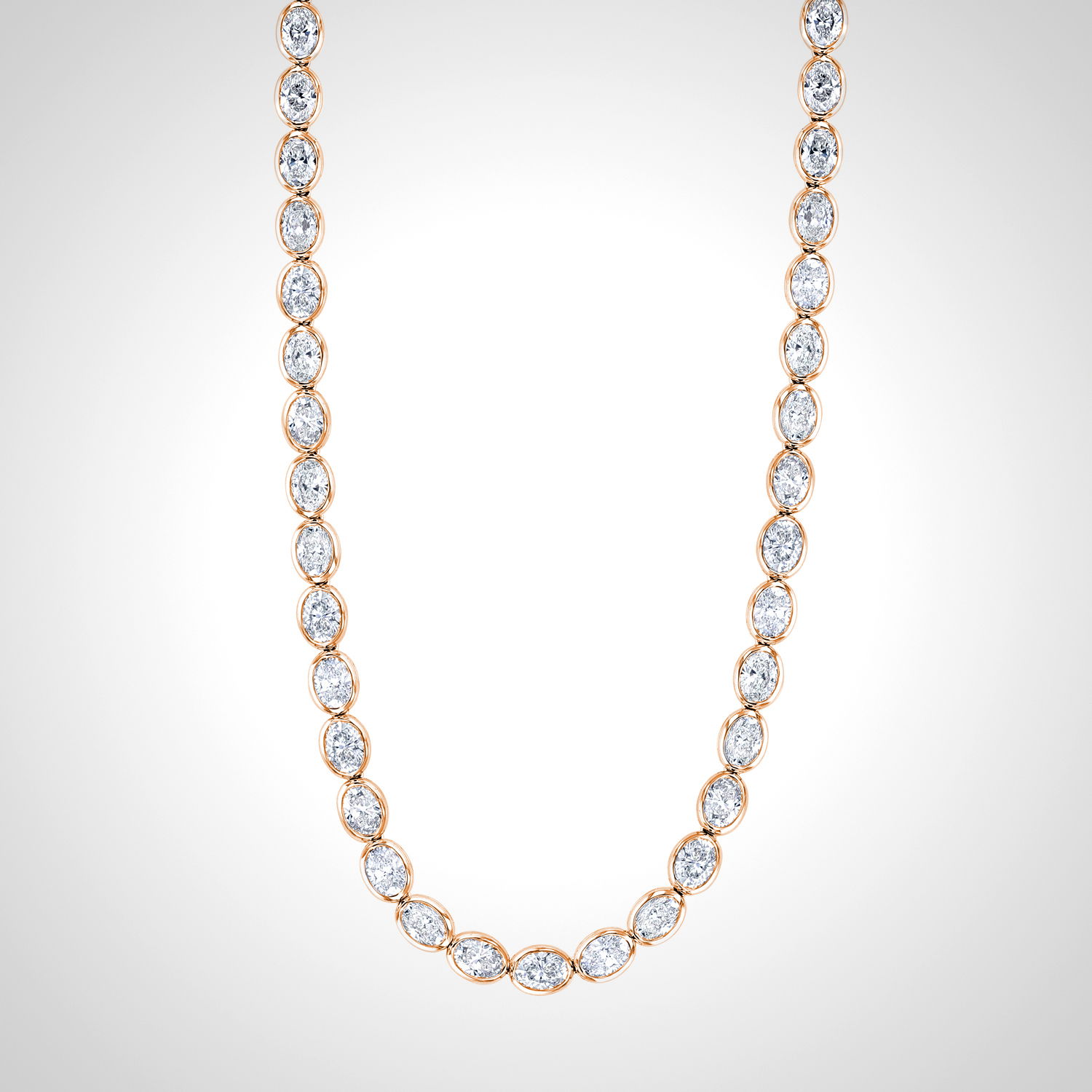 This rose gold necklace features a sleek line of polished oval diamonds set in bezels, creating a refined silhouette with subtle shine. Its minimal design makes it perfect for layering or wearing solo as an everyday staple.-18k Rose gold-Oval diamonds, 8.06ctsItem# 165-2000036 Oval Line Necklace