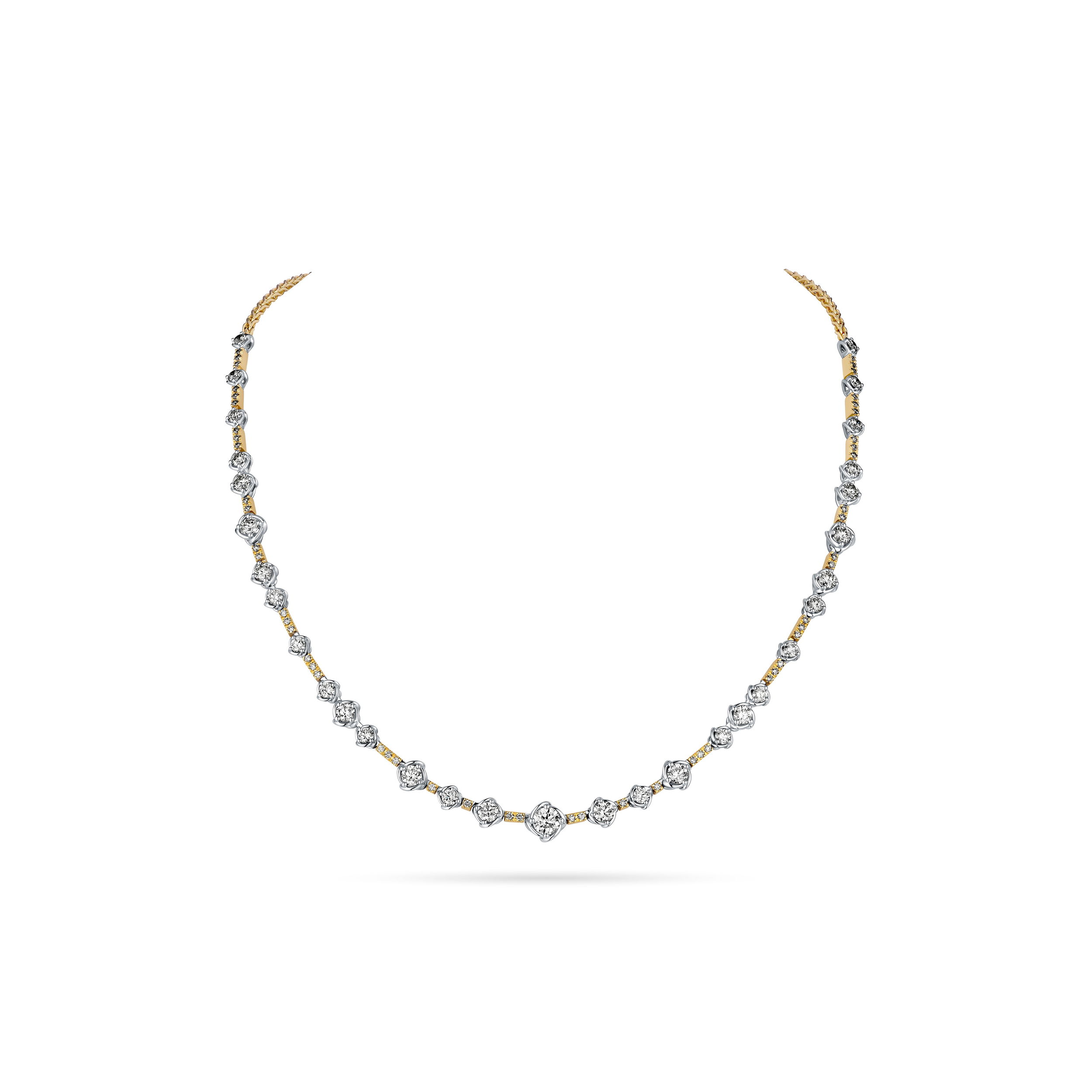 This stationary line necklace features a series of diamonds set in twist bezels, offering a sleek and modern design with timeless elegance. The subtle movement of the bezels enhances the brilliance of each diamond, making it a perfect choice for any occasion.-18k Two toned gold-Round diamonds, 4.43ctsItem# 807-2000251 Two Toned Station Necklace