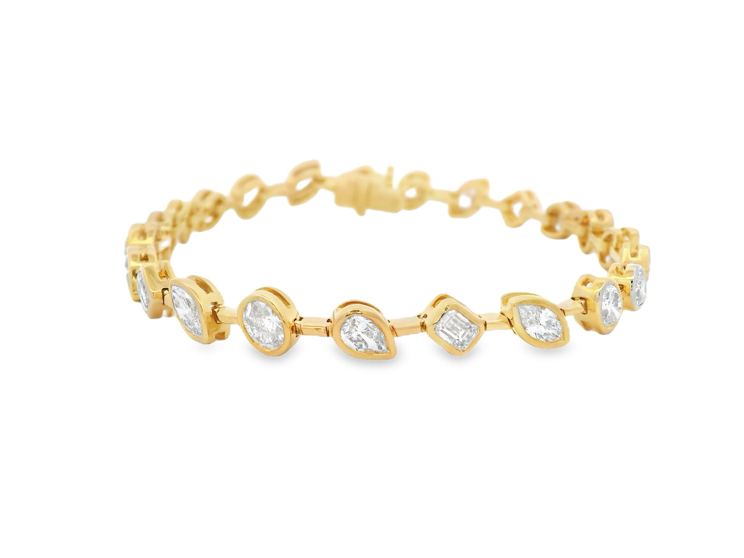 This exquisite tennis bracelet features a stunning array of diamonds in various shapes, each set in sleek bezels for a modern, refined look. The secure bezel setting enhances the brilliance of each diamond, creating a sophisticated piece that is perfect for both everyday wear and special occasions.-18k Yellow gold-Various Shapes Diamonds, 5.85cts-Length 7"Item# 808-2000210 Multi-Shape Diamond Tennis Bracelet