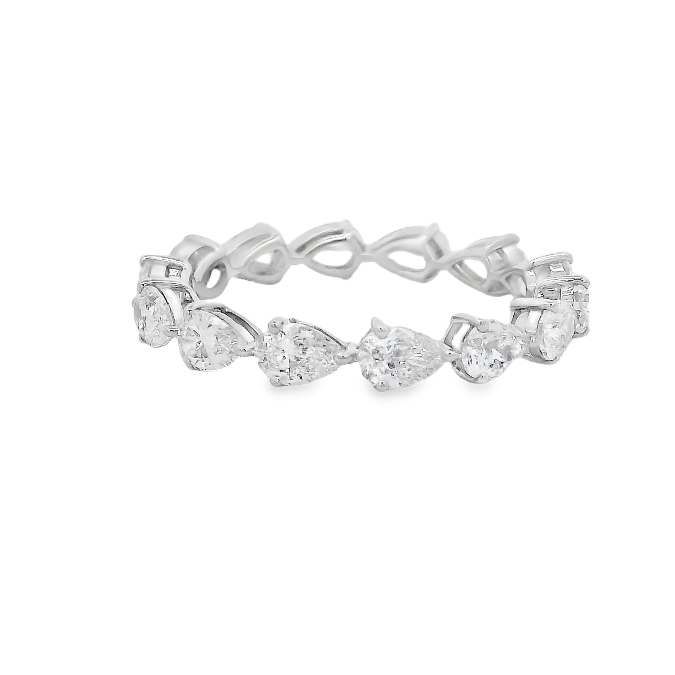 This stunning eternity band features pear-shaped diamonds set east to west, creating a unique and modern twist on a classic design. The continuous line of diamonds symbolizes eternal love, while the east-to-west setting adds a contemporary touch, making this piece perfect for those seeking something both timeless and distinctive.-18k White gold-Pear Diamonds, 1.88cts-Size 6.5, Contact For Sizing OptionsItem# 120-2000020 East West Pear Eternity Band