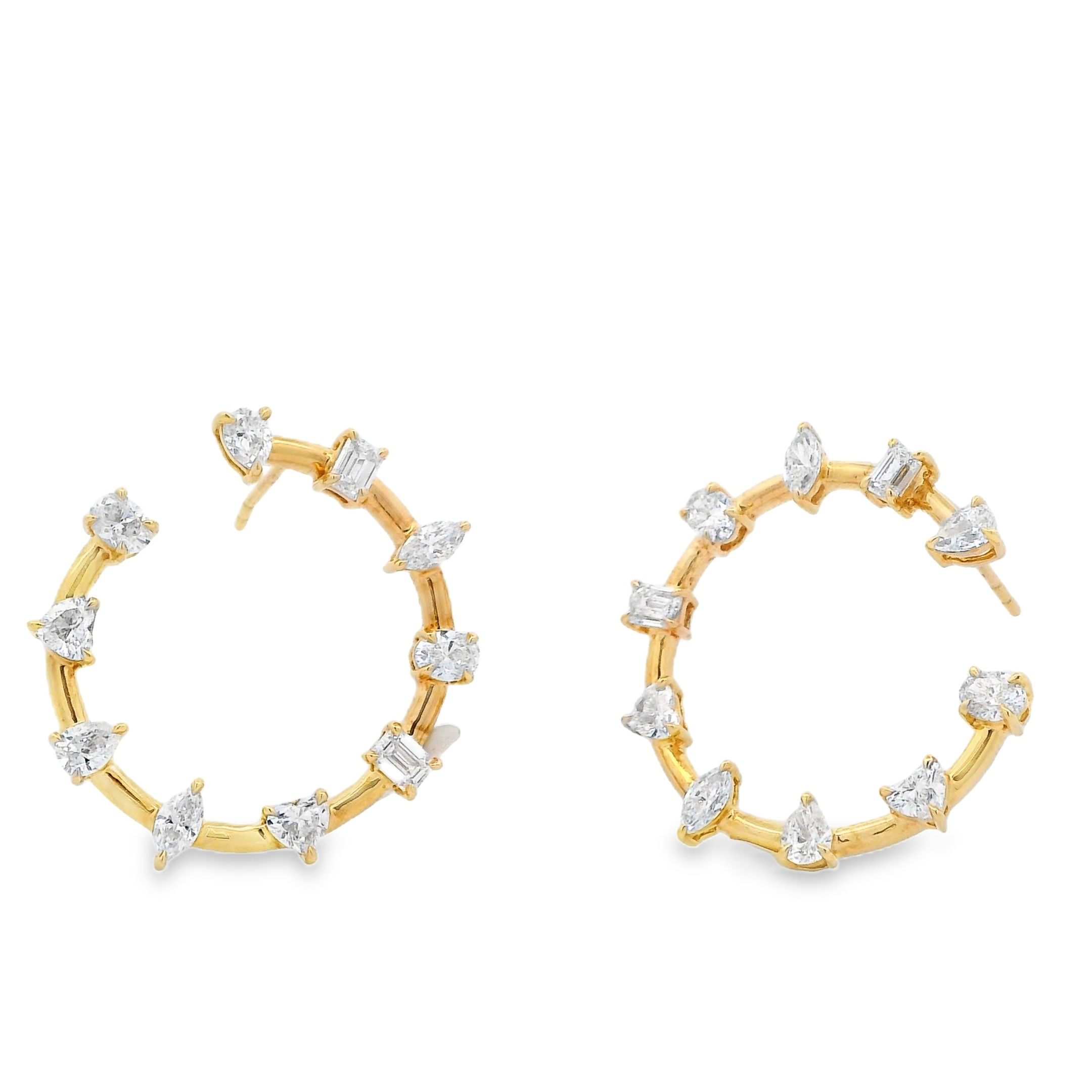 These elegant stud earrings create a loop shape and showcase a stunning array of diamonds in various shapes, creating a dynamic and eye-catching design. -18k Yellow gold-Various shaped diamonds, 3.38ctsItem# 805-2000381 Diamond Loop Earrings