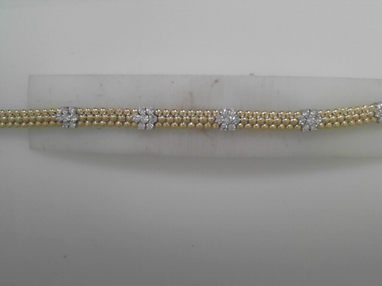 Delicate and timeless, this line bracelet showcases stationary floral diamond clusters, each one blooming with brilliance. A feminine take on a classic style, it adds a romantic sparkle to any look.-14k Two-Tone Yellow and White gold-Round diamonds, 1.62cts-SizeItem# 808-2000213 Floral Cluster Diamond Bracelet