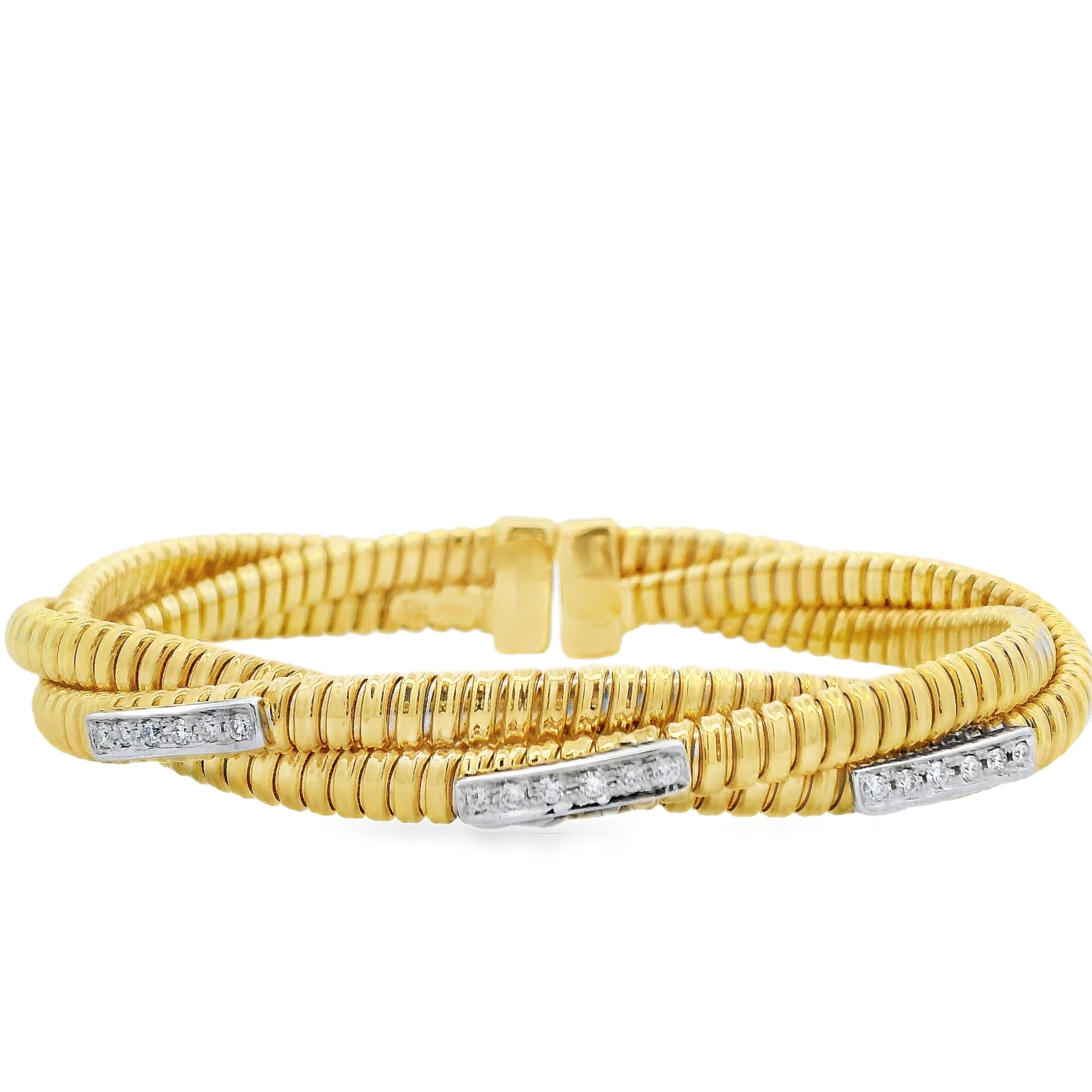This two-tone twisted coil bangle blends modern edge with timeless sparkle. Crafted with precision, it features stationary diamond sections that add brilliance and structure to its fluid, sculptural form. A versatile piece that effortlessly elevates your everyday style.-18k Two-Tone Yellow and White gold-Round diamonds, 0.21cts-SizeItem# 808-2000214 Twisted Coil Bangle