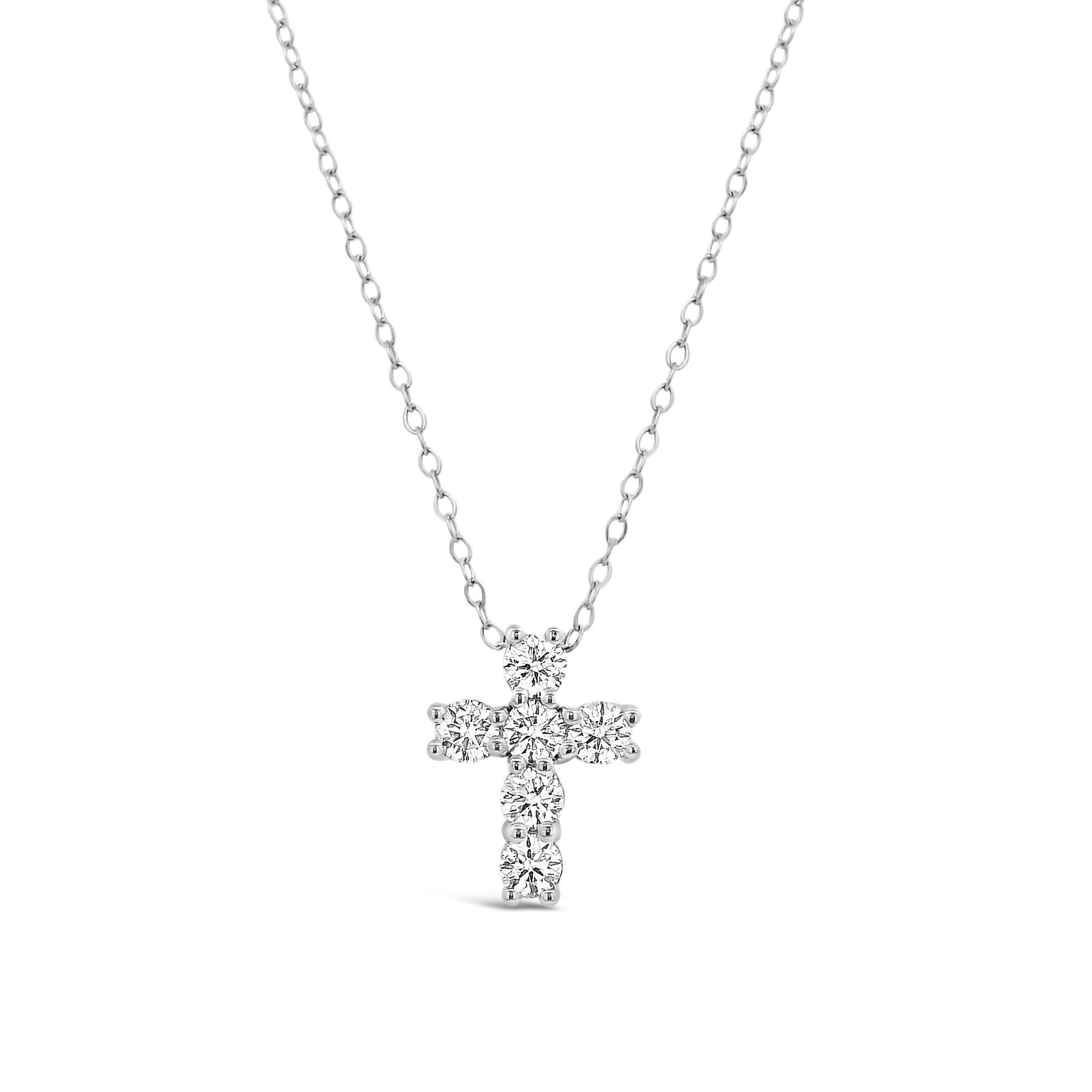 Crafted in 14k white gold, this diamond cross necklace offers a refined take on a classic symbol. Easy to wear every day or layer with your favorites for added shine.-14k White gold-Diamonds, 0.59ctsItem# 807-2000256 White Gold Diamond Cross Necklace