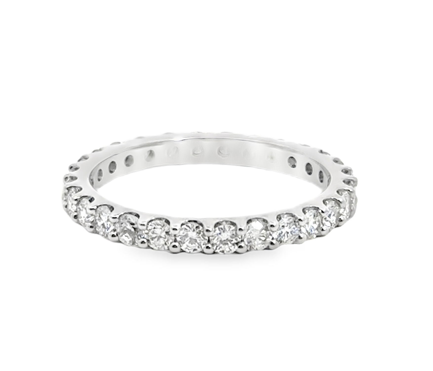 This white gold eternity band offers a sleek and sophisticated look, perfect for everyday wear. Its sparkling diamonds create a continuous timeless expression of love and commitment.-18k White gold-Diamonds, 1.11ctsItem# 110-2000032 White Gold Eternity Band
