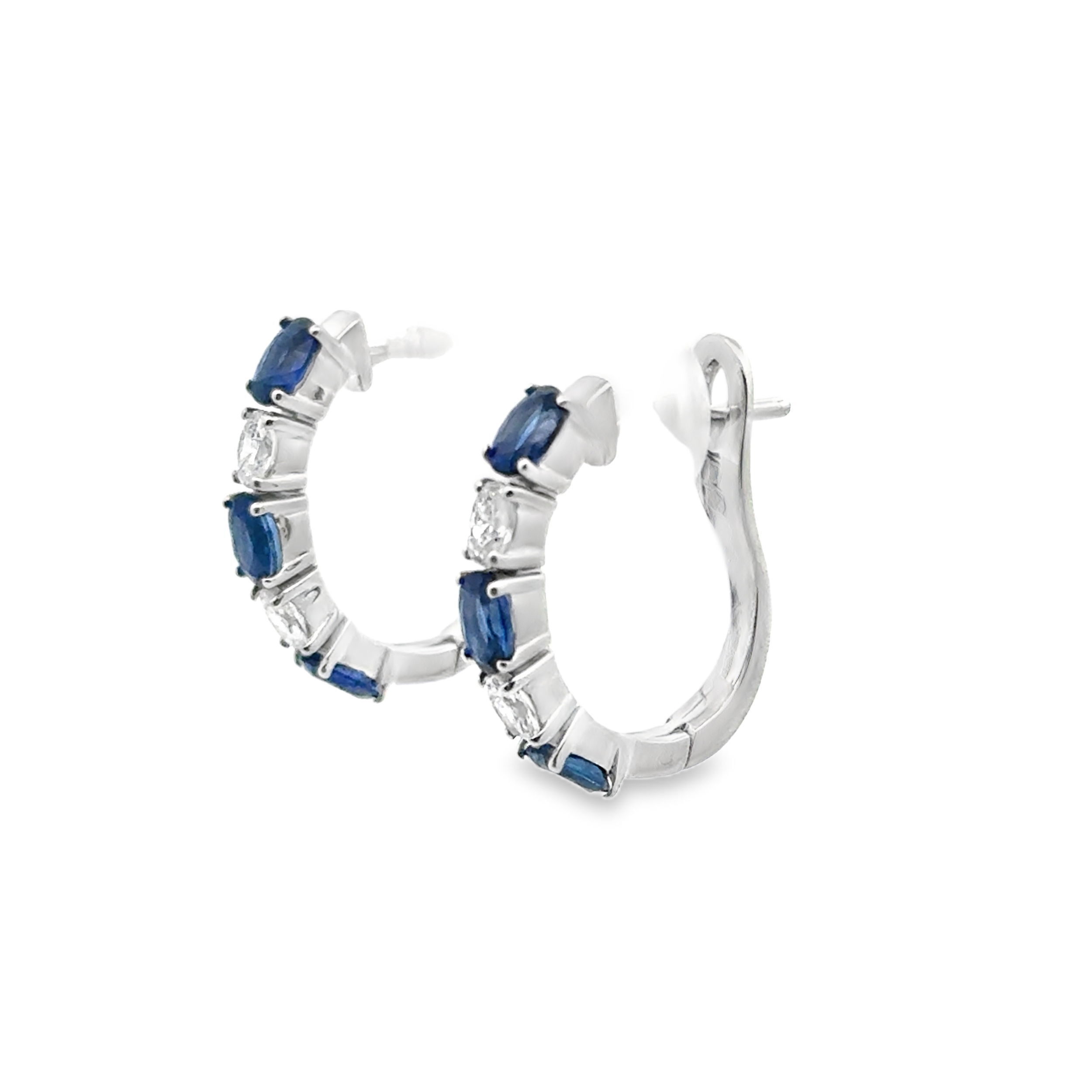 Elevate your look with these exquisite hoop earrings featuring alternating oval sapphires and diamonds. The deep blue of each sapphire is beautifully contrasted by the brilliance of each diamond, creating a timeless and elegant design. Perfectly crafted for everyday luxury or special occasions, these hoops add a refined pop of color and sparkle to any ensemble.-Blue Sapphires, 1.45cts-Oval Diamonds, 0.36ctsItem #: 805-2000391 Blue Sapphire & Diamond Hoops