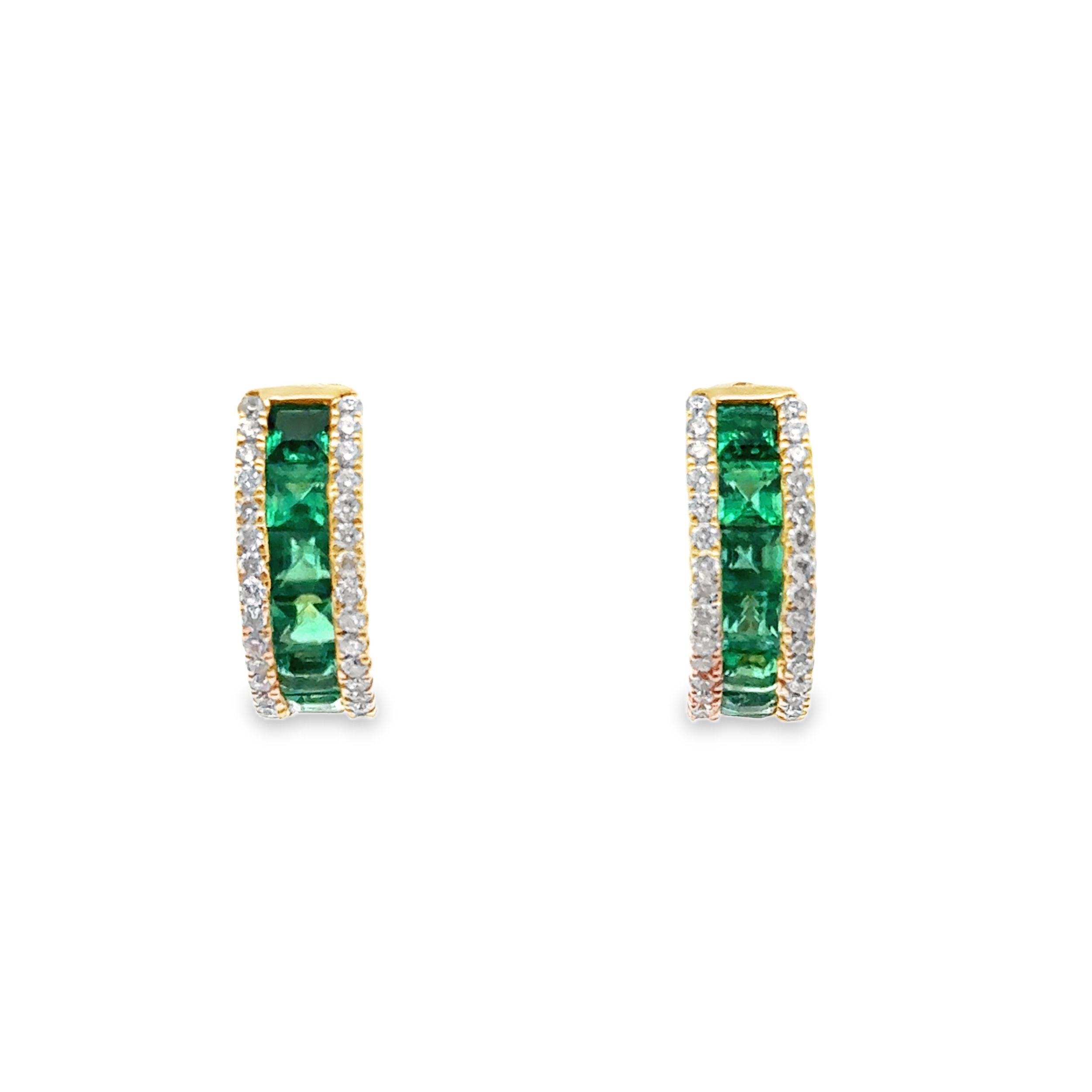 Add a vibrant touch of elegance with these emerald and diamond hoops. Rich green emeralds are perfectly paired with brilliant white diamonds, creating a stunning contrast that catches the eye. Set in a sleek hoop design, these earrings offer timeless sophistication with a colorful twist.-Emeralds, 1.33cts-Round Diamonds, 0.34cts-Omega back Item# 805-2000393 Emerald & Diamonds Hoops