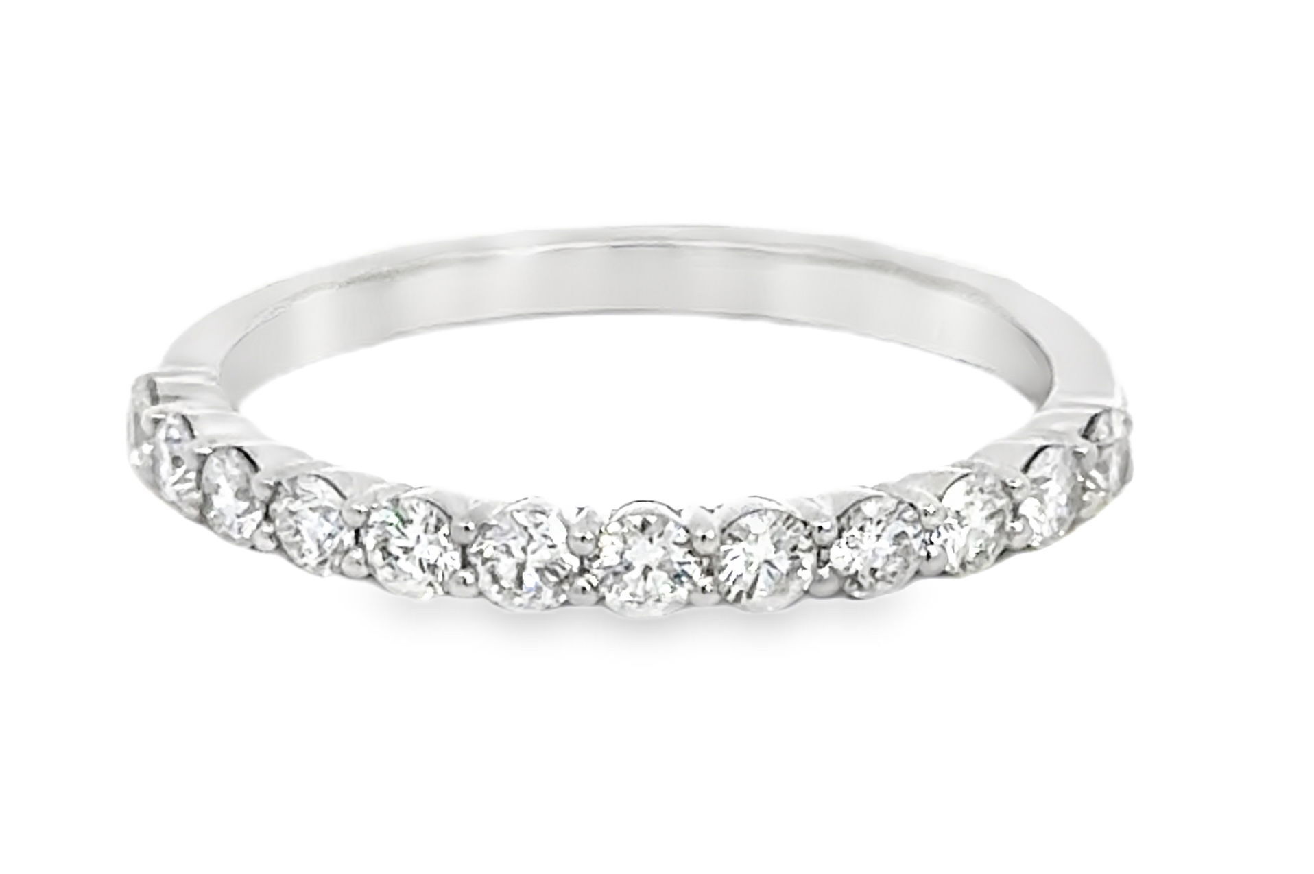 This wedding band radiates modern sophistication with its sleek 18k white gold construction. The delicate diamonds add a subtle sparkle that’s both classic and enduring.-18k White gold-Diamonds, 0.46cts-Contact for sizing options.Item# 110-2000034 Round Diamond Wedding Band