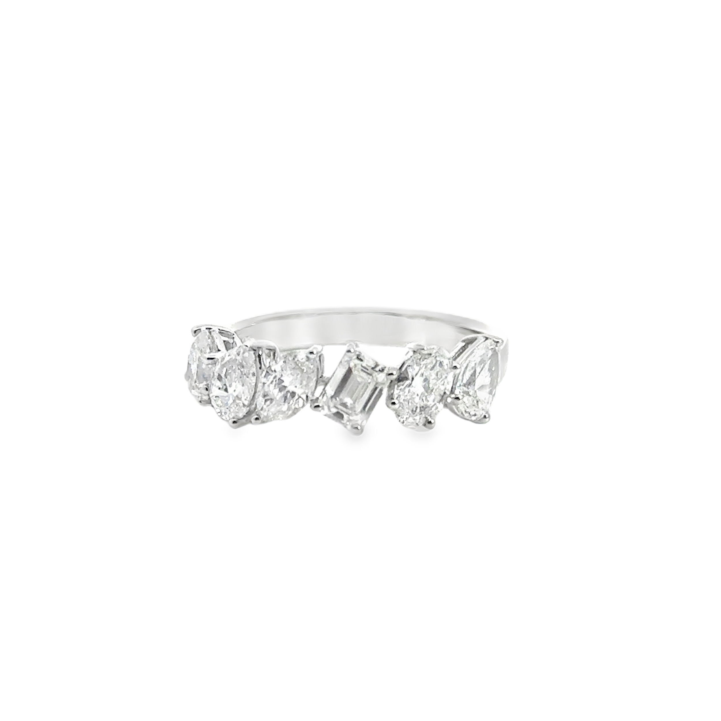 Celebrate your love with this distinctive anniversary band featuring a mix of diamond shapes and set in 18k White gold. Expertly set to highlight each stone’s unique brilliance, this design adds texture and sparkle for a look that’s both modern and timeless. A meaningful piece to mark a special milestone.-18k White gold-Multi-Shape diamonds, 1.83cts-Size 6.5, Contact for sizing optionsItem# 130-2000028 Multi-Shape Diamond Ring