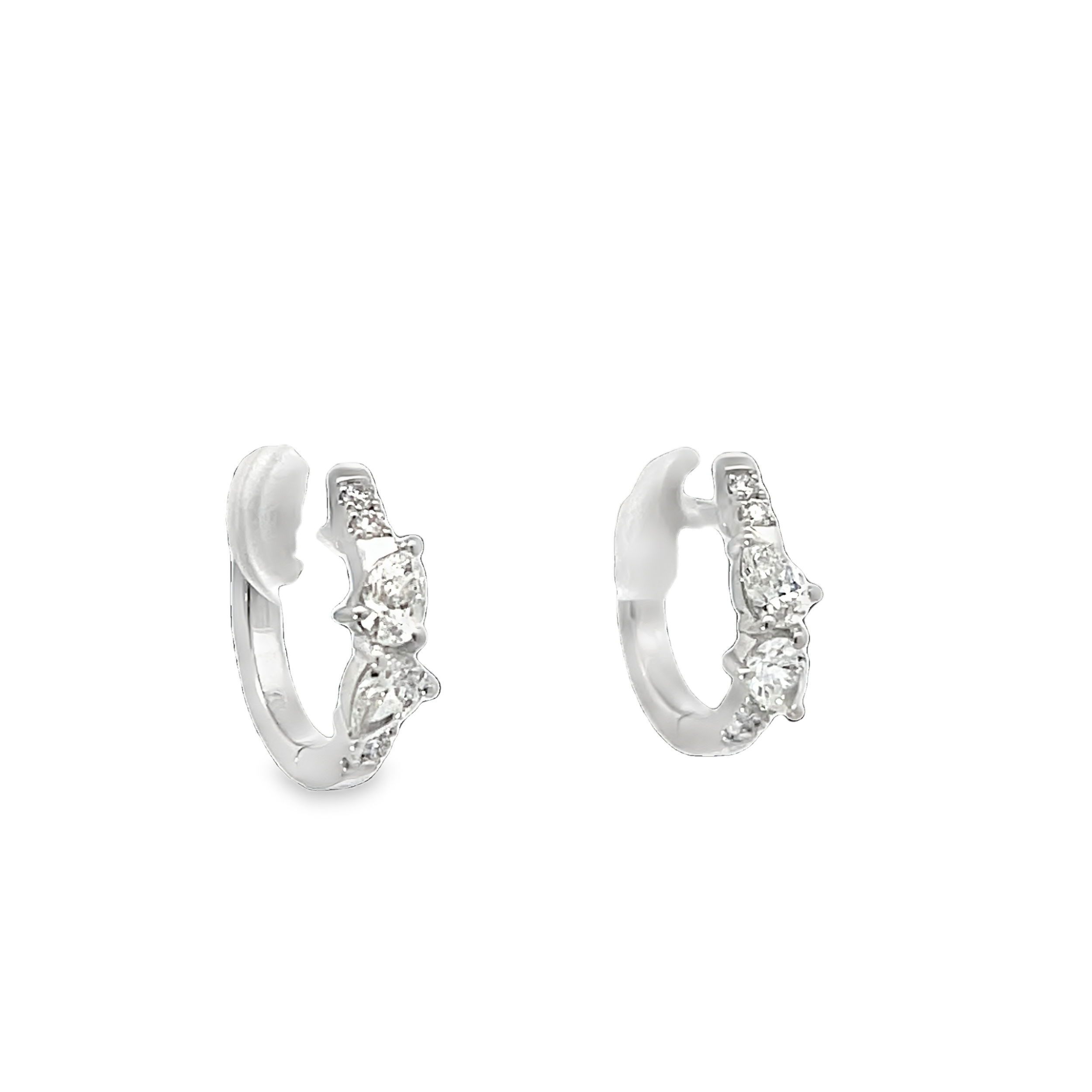 These huggies feature a sleek, close-fitting design adorned with sparkling diamonds for a timeless and elegant look. Designed with versatility in mind, they can be worn alone or paired with charms for a personalized touch.-18k White gold-Round, Pear diamonds, 0.48ctsItem# 805-2000395 Diamond Huggies