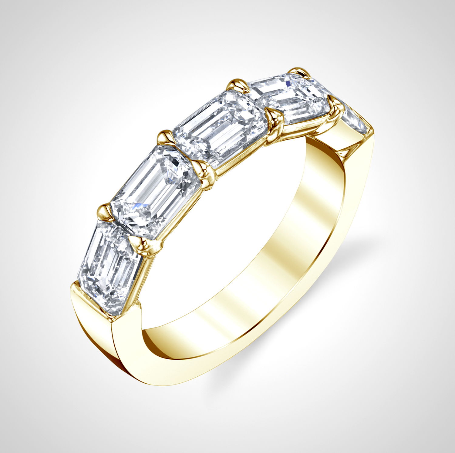This 18k yellow gold anniversary ring features a seamless row of emerald cut diamonds totaling 2.13 carats. Its clean lines and timeless silhouette make it a striking symbol of enduring love.-18k Yellow gold-Emerald Cut Diamonds, 2.13cts--Size 6, Contact for sizing optionsItem #: 110-2000035 Emerald Cut Anniversary Band