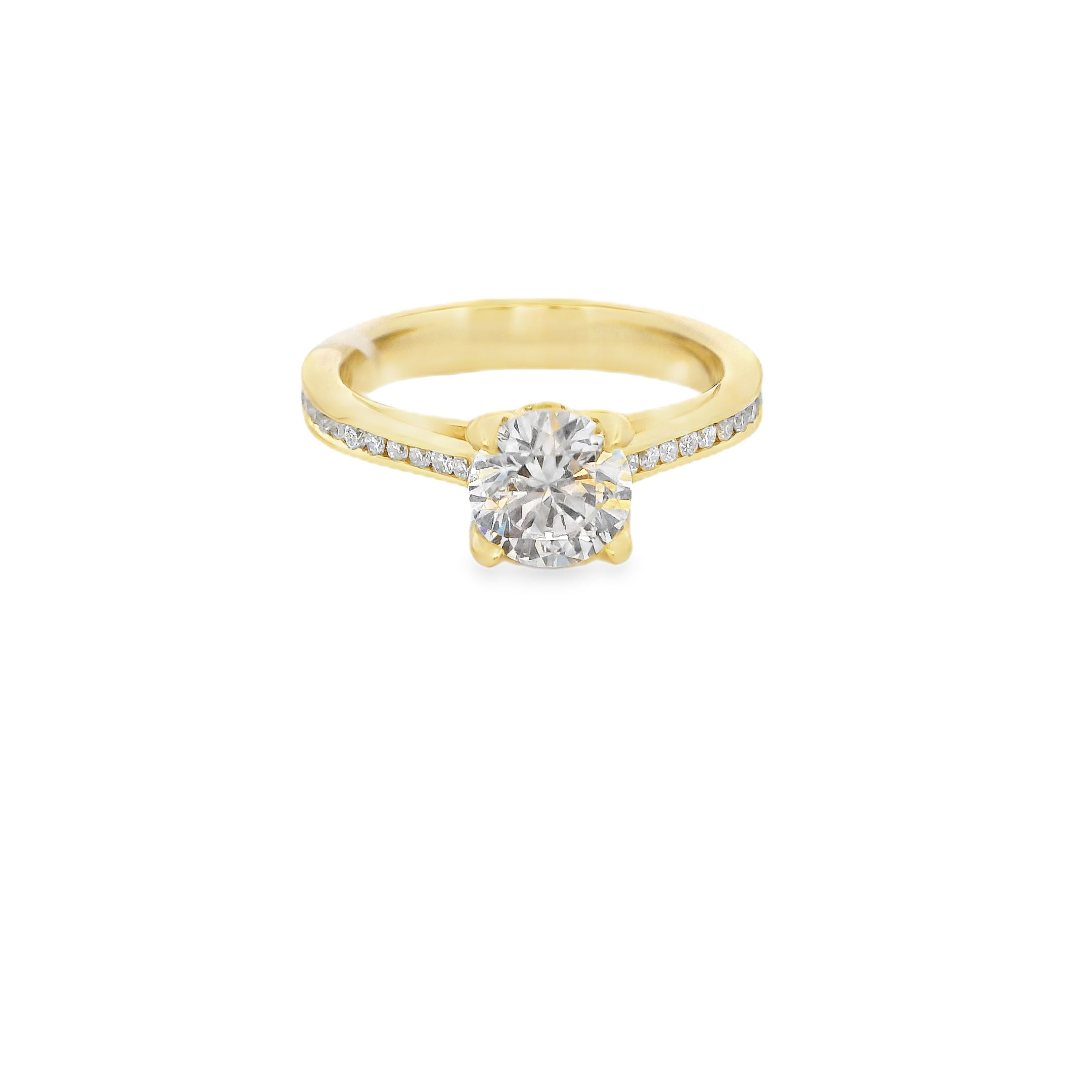 This cathedral semi-mount in 18k Yellow gold features channel set diamonds along the band, offering a sleek and sophisticated look. The raised cathedral setting provides a graceful lift to showcase your center stone, while the secure channel setting adds brilliance and durability. (Center stone not included)-18k Yellow gold-Round Diamonds, 0.21cts-Size 6.5, Contact for sizing optionsItem# 140-2000024 Channel Solitaire