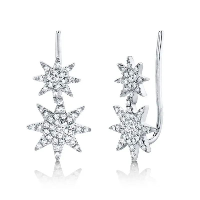 Elevate your style with these stunning white gold earrings, featuring a unique starburst design. Adorned with sparkling round diamonds, these earrings add a touch of elegance and brilliance to any look. -14k White gold-Starburst design-Round diamonds, 0.22cts -Climber style for pierced ears Item# 805-2000407 Starburst Ear Climbers