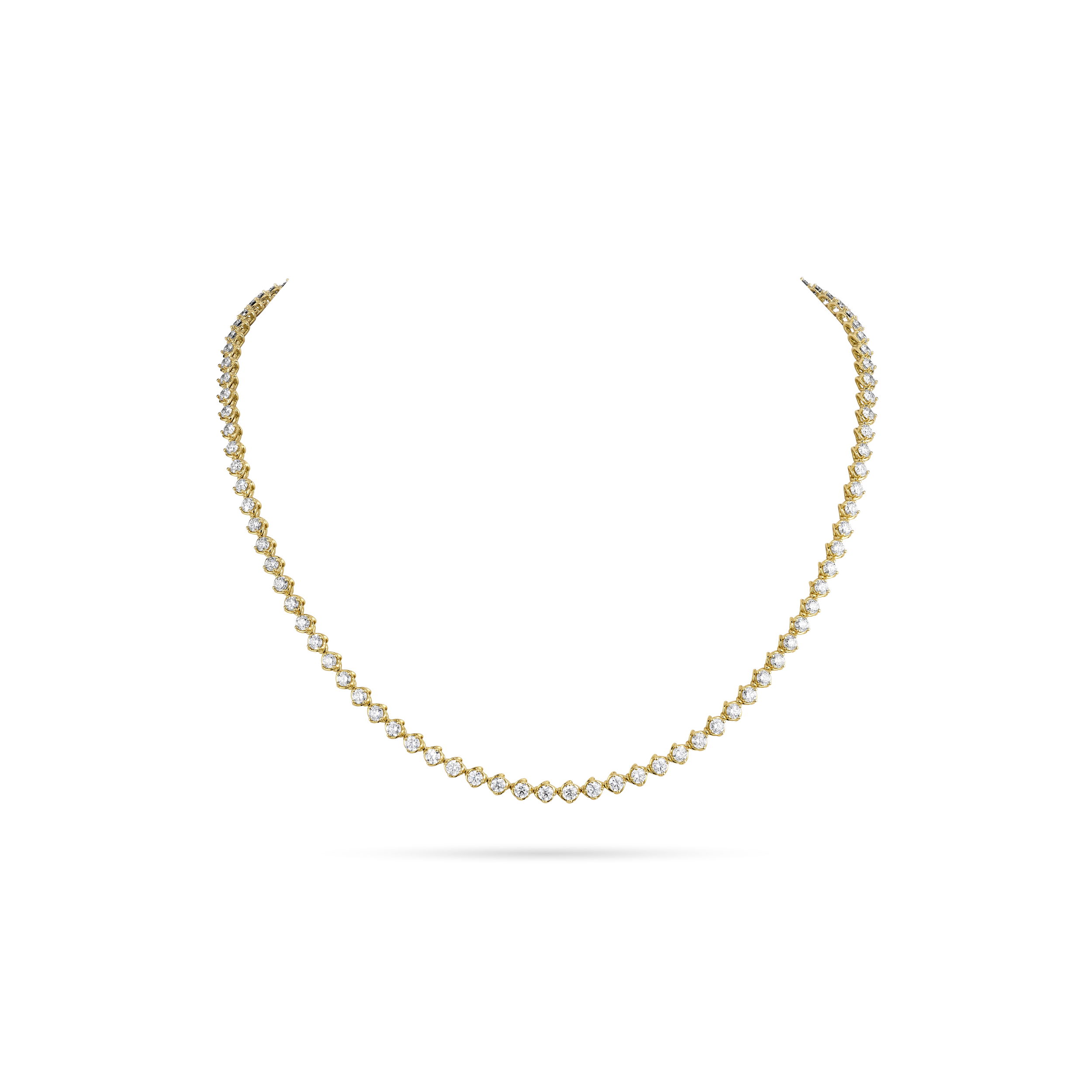 A modern twist on a timeless design, this line necklace features brilliant diamonds set in elegant twisted faux bezels. The unique setting adds texture and dimension, giving each diamond a distinctive frame that catches the light beautifully. A sophisticated piece perfect for layering or wearing solo.-18k Yellow gold-Round diamonds, 6.87cts-Length 16 inchesItem# 165-2000044 Diamond Line Necklace