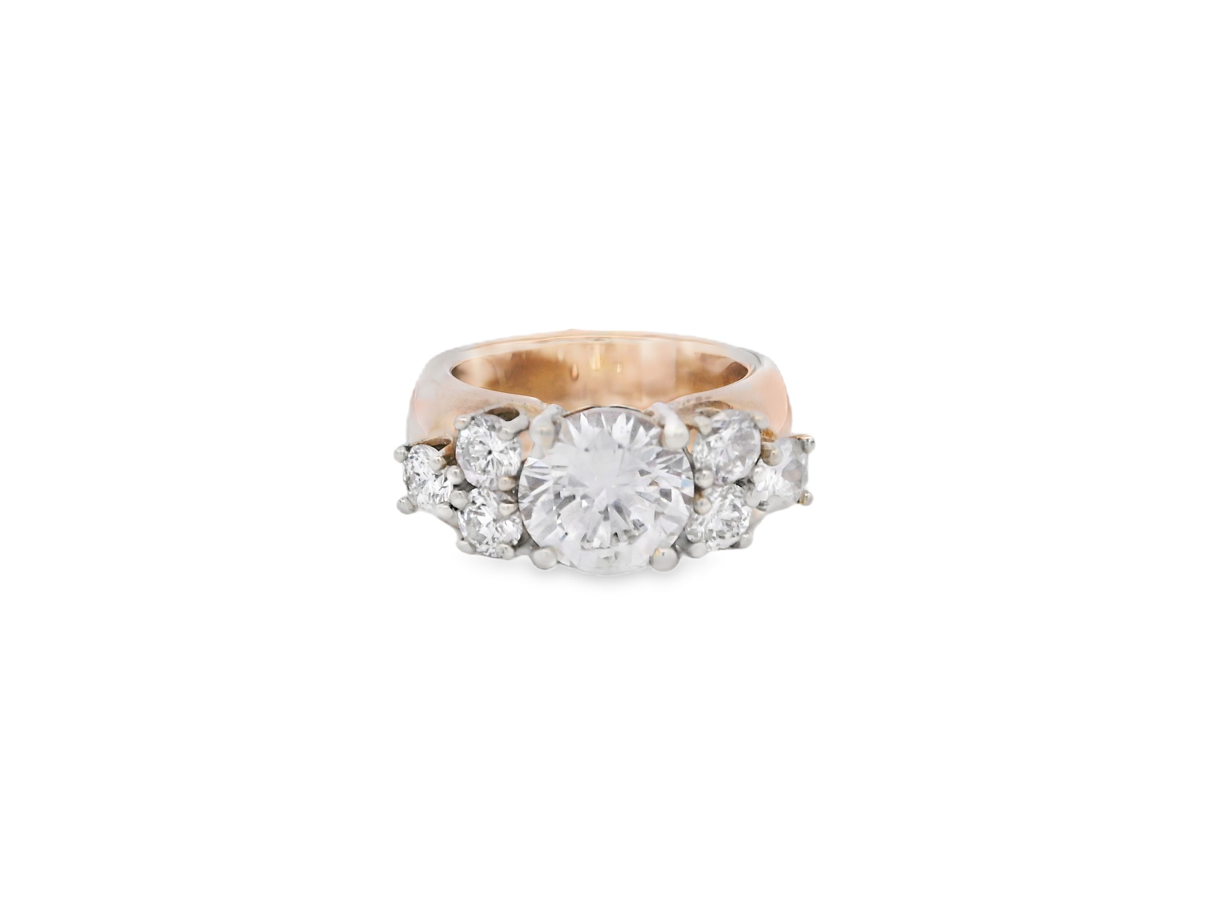 This striking 14k Yellow gold engagement ring showcases a 2.21ct round diamond set on a bold, wide band. Three round diamonds on each side add brilliance and balance, creating a look that’s both timeless and full of presence. A perfect choice for those who appreciate classic beauty.-14k Yellow gold-Round diamond, 2.21cts-Round diamonds, 1.25cts-Size 4.75, Contact for sizing optionsItem# 100-2000033 Cluster Engagement Ring