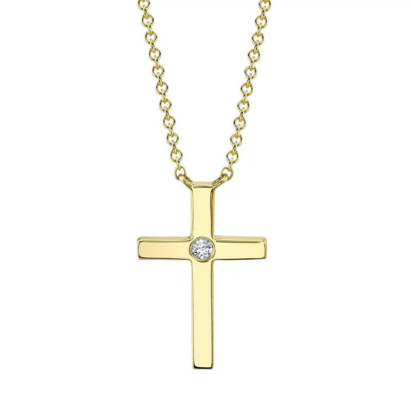 This delicate Cross pendant is crafted in yellow gold, offering a timeless and elegant design. Featuring a single round diamond at the center, this pendant is beautifully suspended on a stationary chain.-14k Yellow gold-Round diamond, 0.03cts-Chain length, 15"-18" on adjustable chainItem# 807-2000275 Small Diamond Cross Pendant