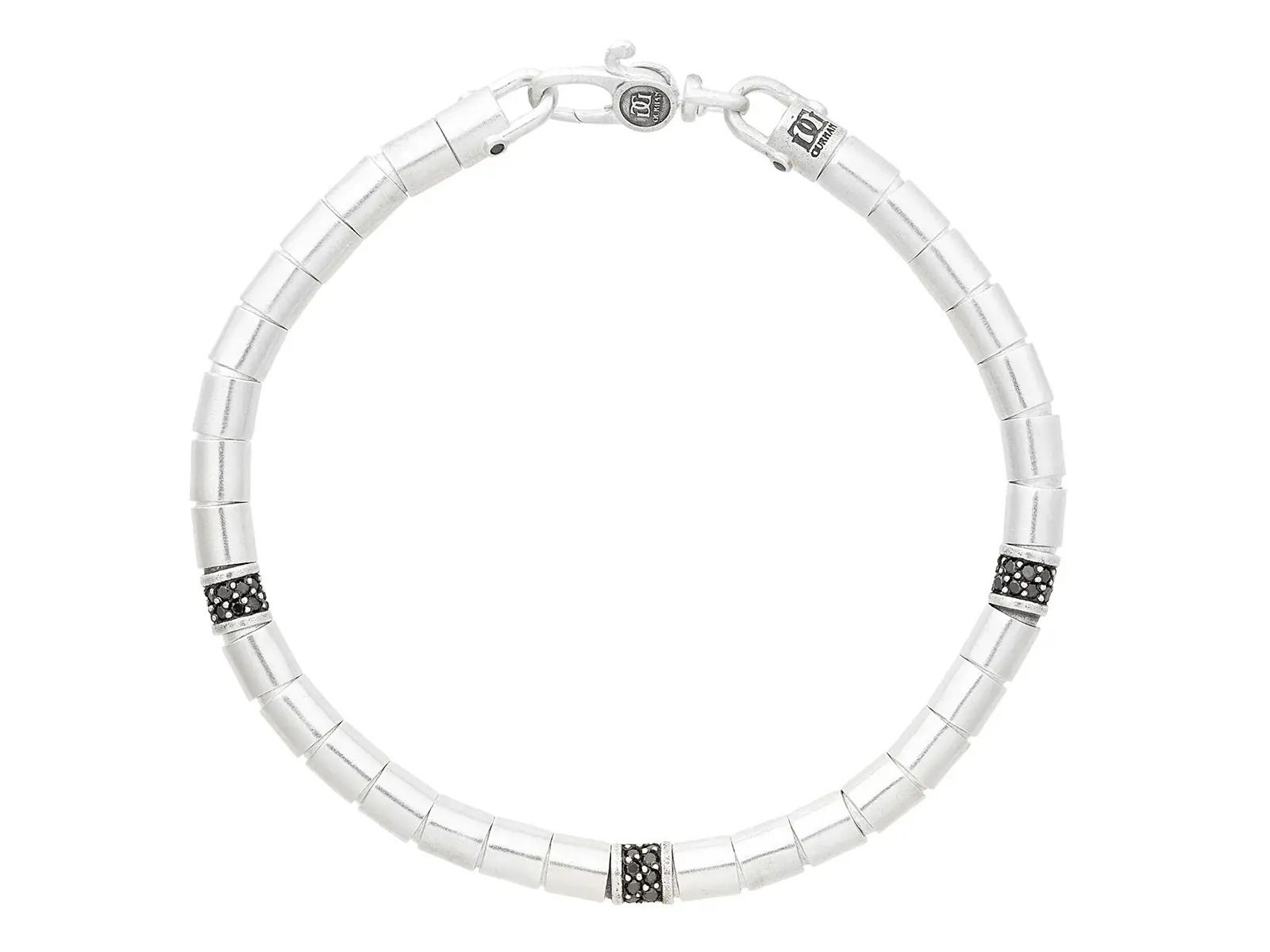 This sterling silver bracelet features black diamonds, three pavé stations, and bold tube beads for a sleek, modern edge. Wear it solo for understated style or pair it with other accessories for a layered look.-Sterling silver-Black diamonds, 0.63cts-Length 8"Item# 800-2000056 Silver Bracelet with Three Pavé Stations