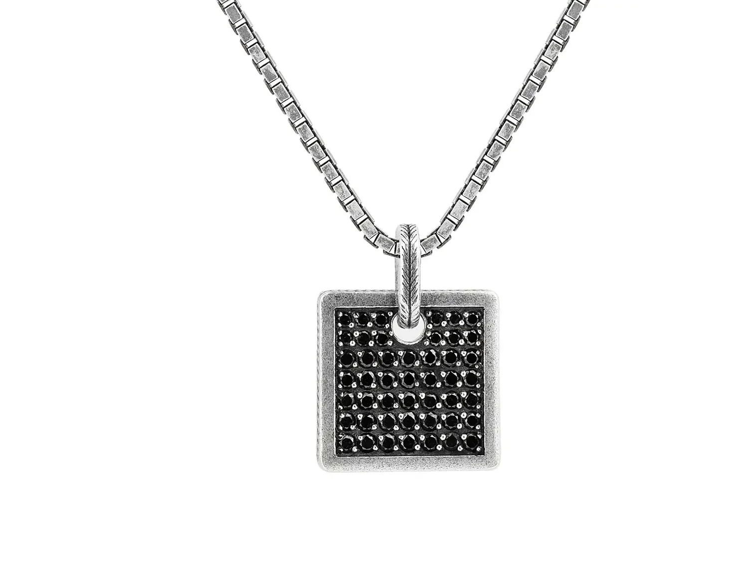 This black diamond and sterling silver square pendant hangs elegantly on a sleek box chain. Its modern design adds a bold, refined touch to any outfit.-Sterling silver-Black diamonds, 1.36cts-25x18mm Rectangle-Length 24"Item# 800-2000060 Black Diamond Pendant on Box Chain