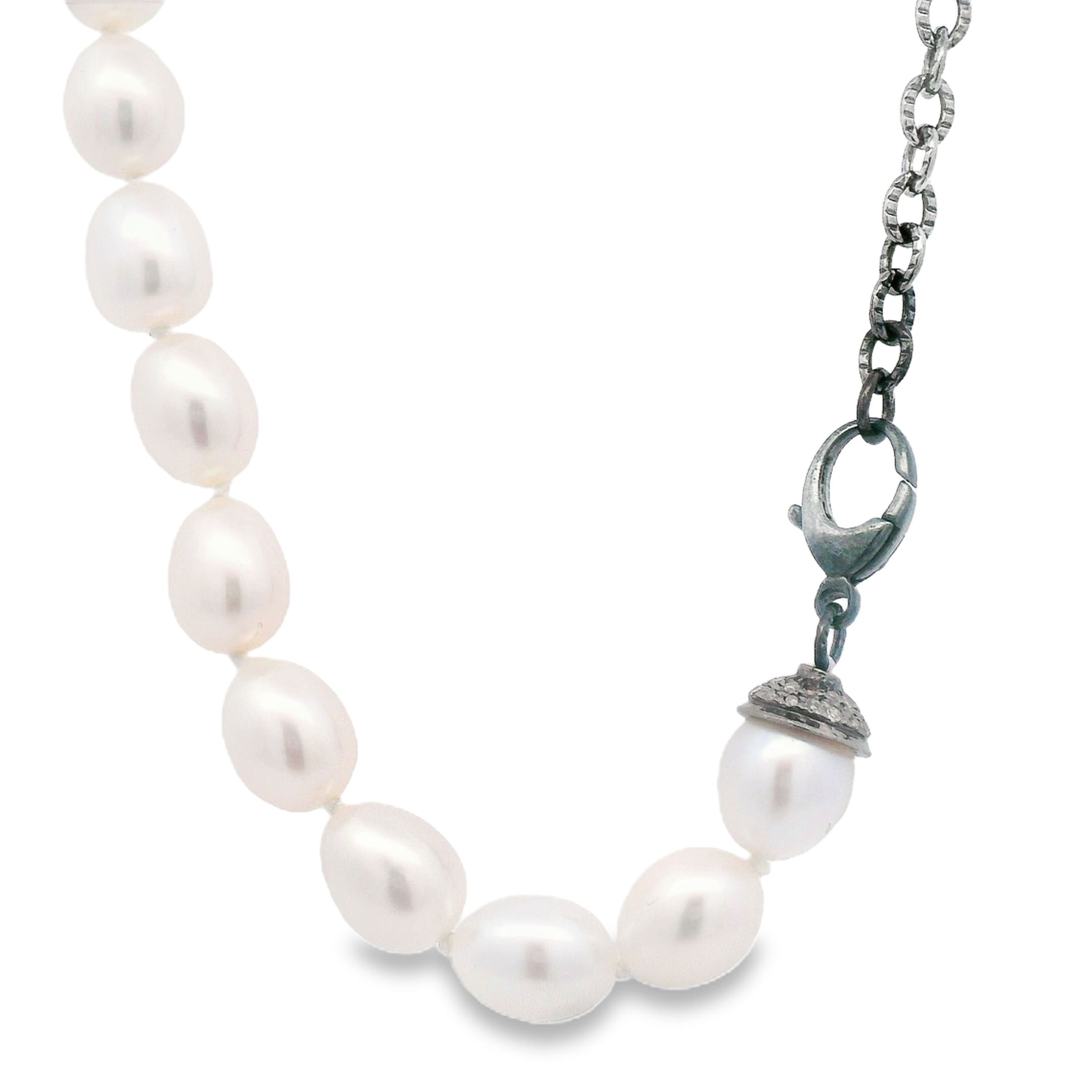 This pearl necklace with its sterling silver chain is a simple and fashionable way to add an extra touch of style to your everyday wardrobe.-Sterling Silver-Fresh water pearls-Length 20.5"Item# ND-NK-00012 Pearl and Silver Chain Necklace