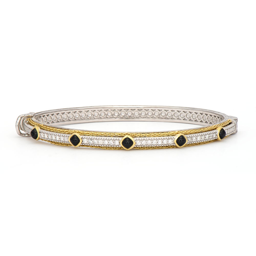 Combining classic elegance with on trend shapes and styles, JFJ offers something for women of all ages. This mixed metal woven rope bangle showcases intricate craftsmanship, featuring vibrant blue topaz stones accented by sparkling diamonds. A perfect blend of texture and elegance, it adds a distinctive touch to any jewelry collection.-18k Yellow and white gold-London blue topaz, 0.44cts-Round white diamondsItem# 808-20002563 Mixed Metal Woven Rope Bangle