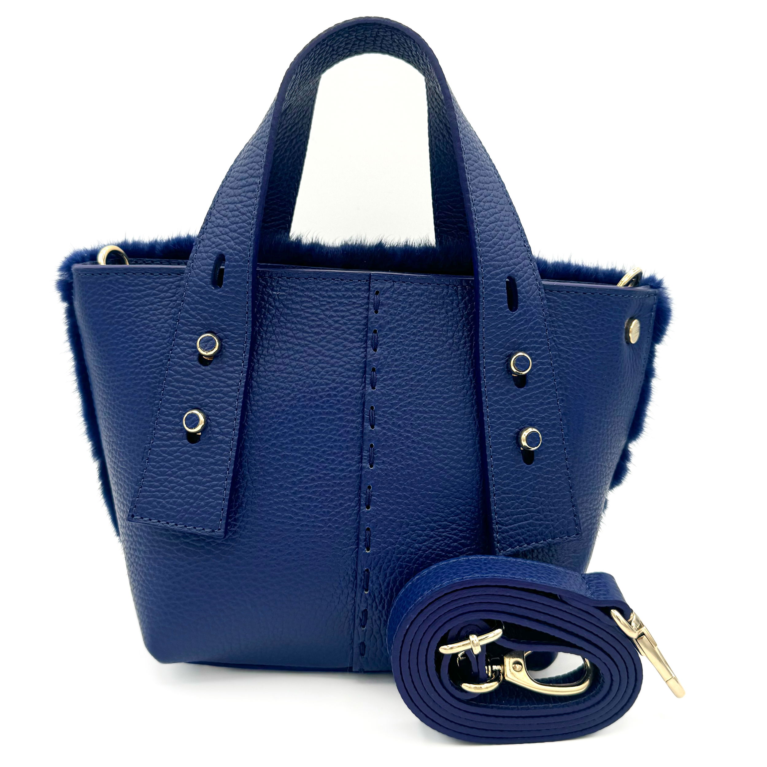 Valerie Naifeh’s line of leather goods features handcrafted handbags and accessories made in Greece from genuine cervo calf leather and natural mink or fox fur. Each piece combines luxurious materials with Valerie’s personally curated color palette for a distinct and elevated look.-Leather-Mink furColor: BlueItem# ND-FUR-00009 Ellie - Leather & Mink
