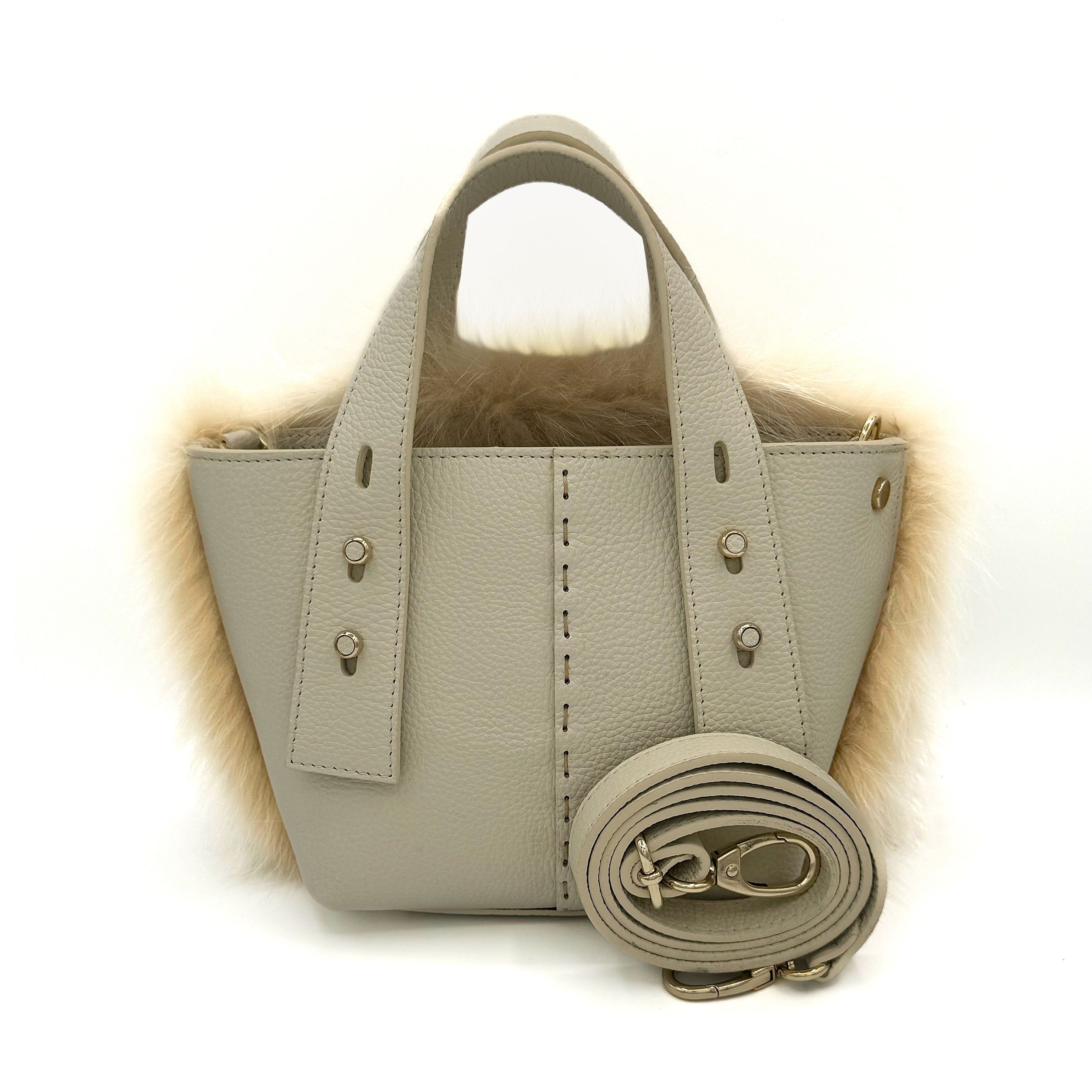 Valerie Naifeh’s line of leather goods features handcrafted handbags and accessories made in Greece from genuine cervo calf leather and natural mink or fox fur. Each piece combines luxurious materials with Valerie’s personally curated color palette for a distinct and elevated look.-Leather-Fox fur-Color: Light beigeItem# ND-FUR-00017 Ellie - Leather & Fox Crossbody