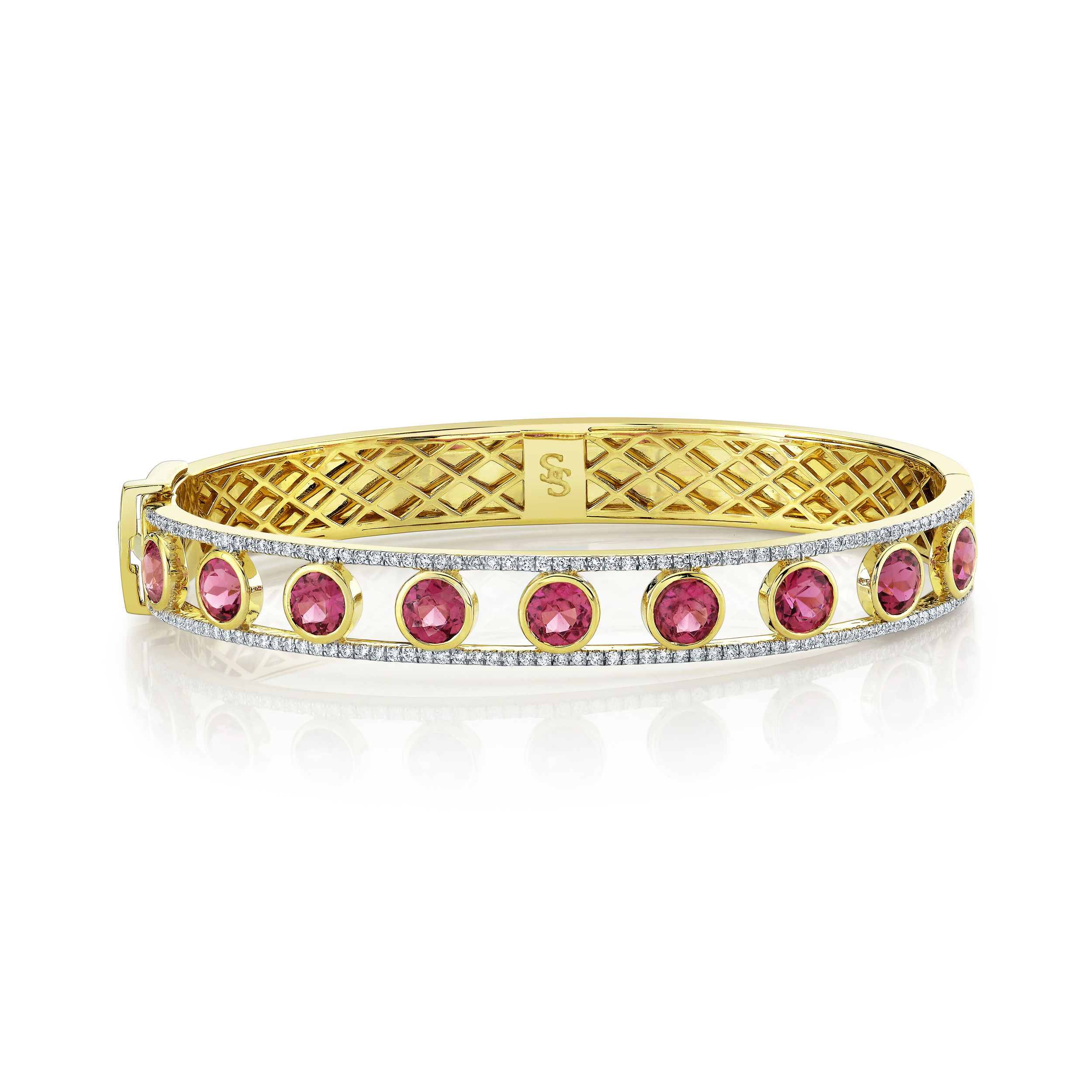 This bracelet boasts an incredibly unique design, with an open section and pink tourmaline stones, it is sure to turn heads as a beautiful statement piece.-18k Yellow gold-Pink tourmaline, 3.86cts-Round diamonds, 0.66ctsItem# 808-2000266 Open Pink Tourmaline & Diamond Bracelet