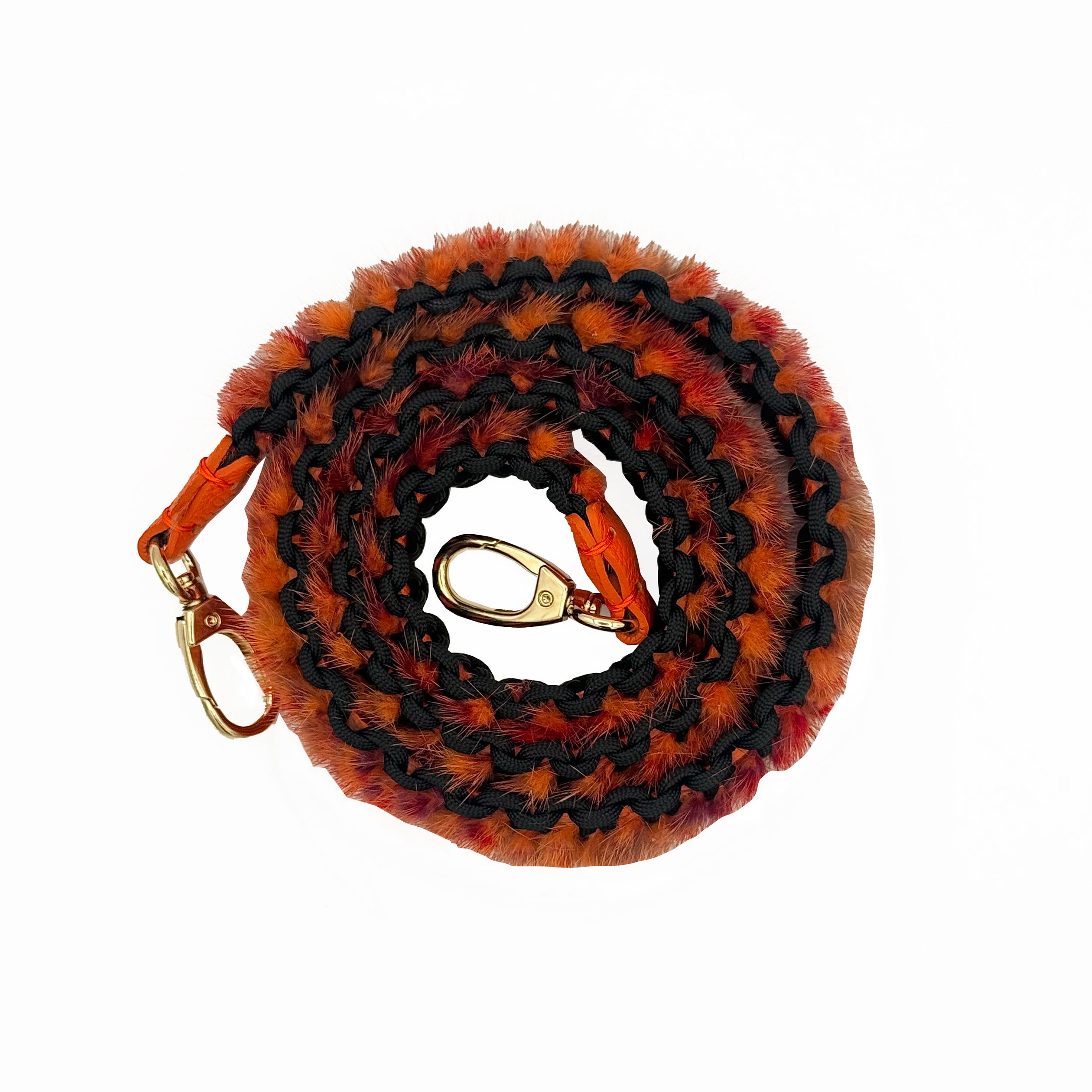 Valerie Naifeh’s line of leather goods features handcrafted handbags and accessories made in Greece from genuine cervo calf leather and natural mink or fox fur. Each piece combines luxurious materials with Valerie’s personally curated color palette for a distinct and elevated look.-Leather-Mink fur-Color: OrangeItem# ND-FUR-00041 Mink Bag Belt - Orange