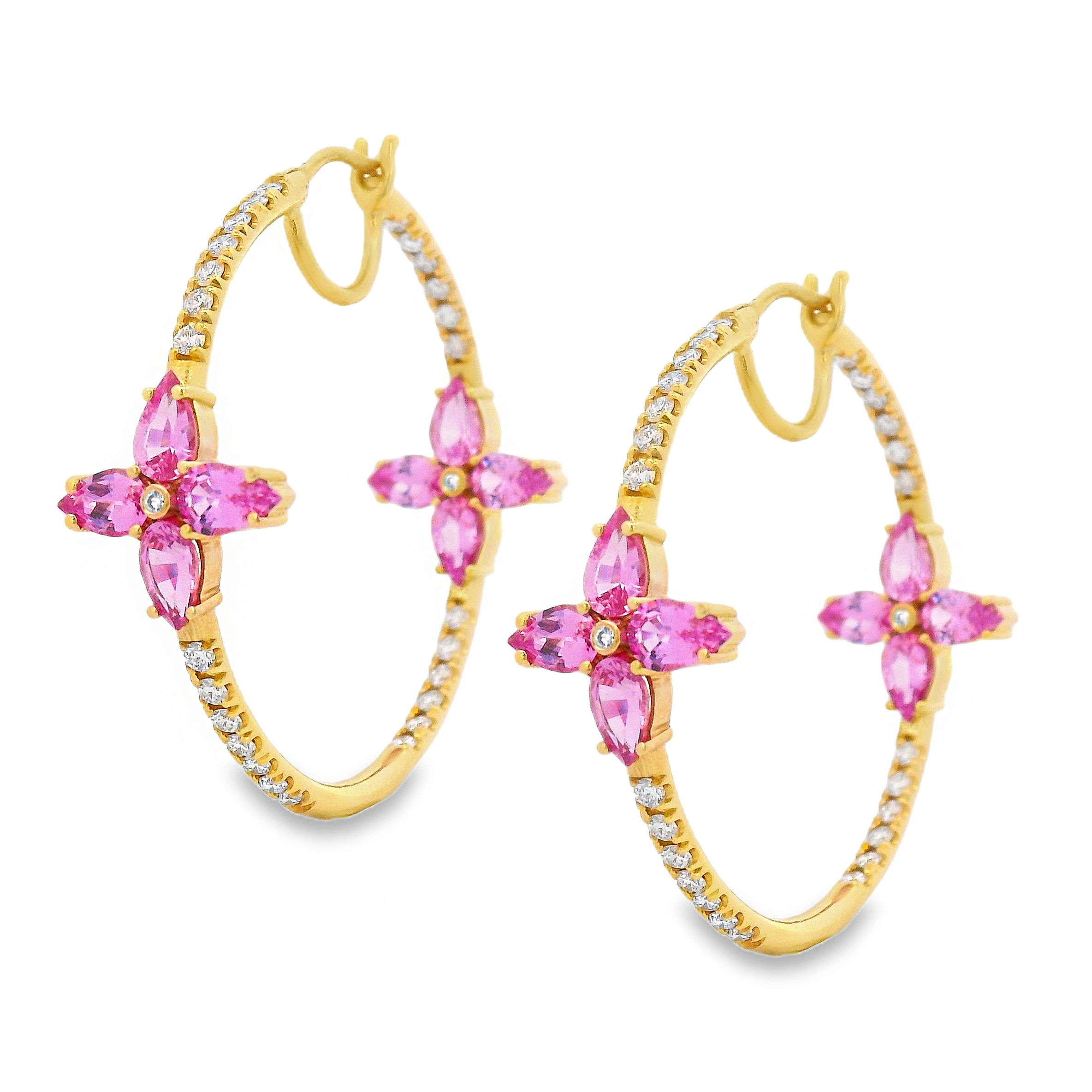 These 18k yellow gold hoops feature 4.53cts of pear-cut pink sapphires arranged to resemble delicate flowers, accented by sparkling diamonds. Elegant and feminine, they bring a vibrant, floral touch to a timeless silhouette.-18k Yellow gold -Pink sapphire, 4.53cts-Diamonds, 1.12ctsItem# 805-2000444 Pink Sapphire Flower Hoops