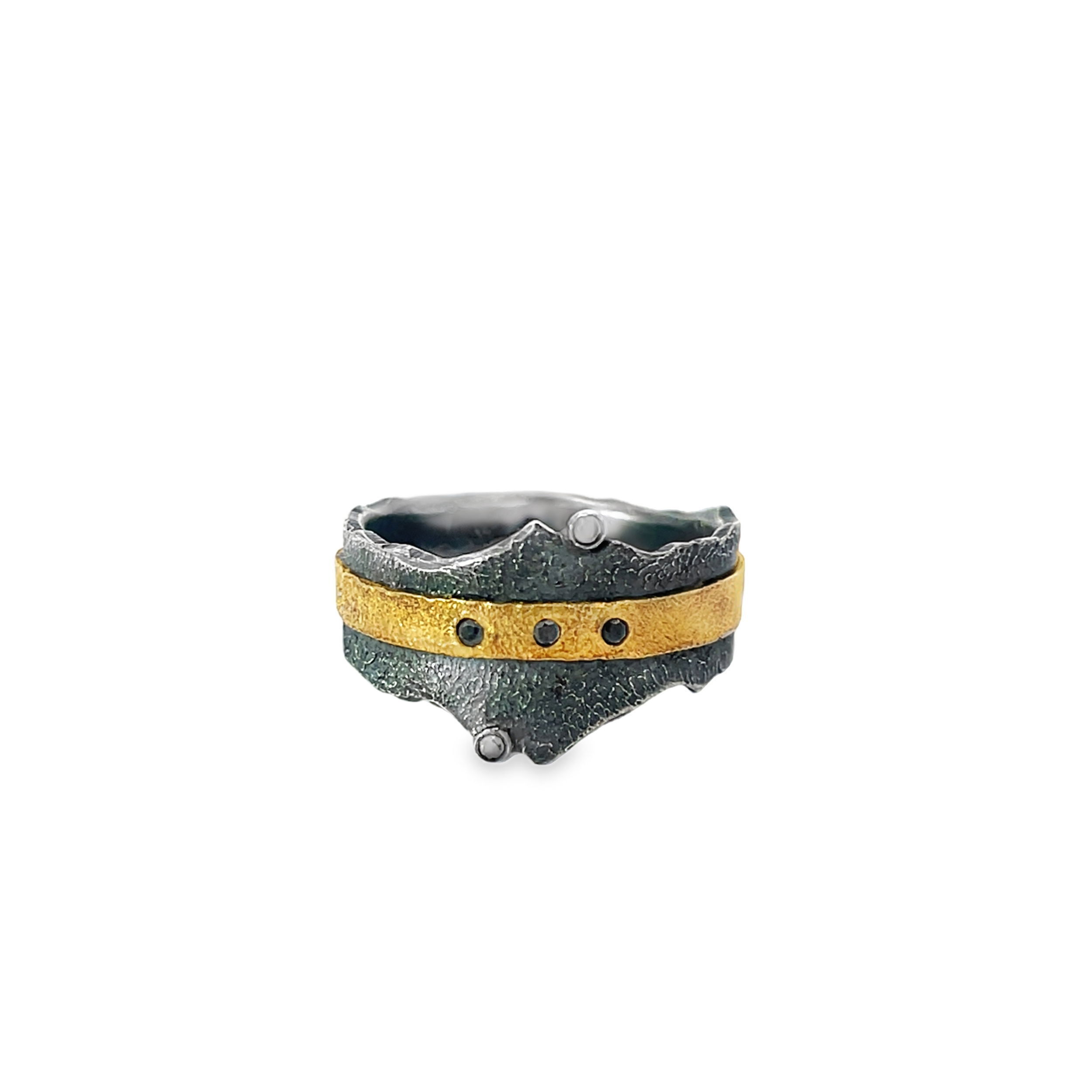 This ring draws inspiration from the jagged peaks of the Sawtooth Mountains, with its textured design mirroring their rugged beauty. With 22k gold adding a refined touch, this is a unique piece that effortlessly blends natural elegance with modern style.-22k Yellow gold-Oxidized stainless steel-Round black diamonds-Sizes 9 & 10Item# 804-2000278 Oxidized Sterling Silver & 22k Gold Ring With Black Diamond Accents