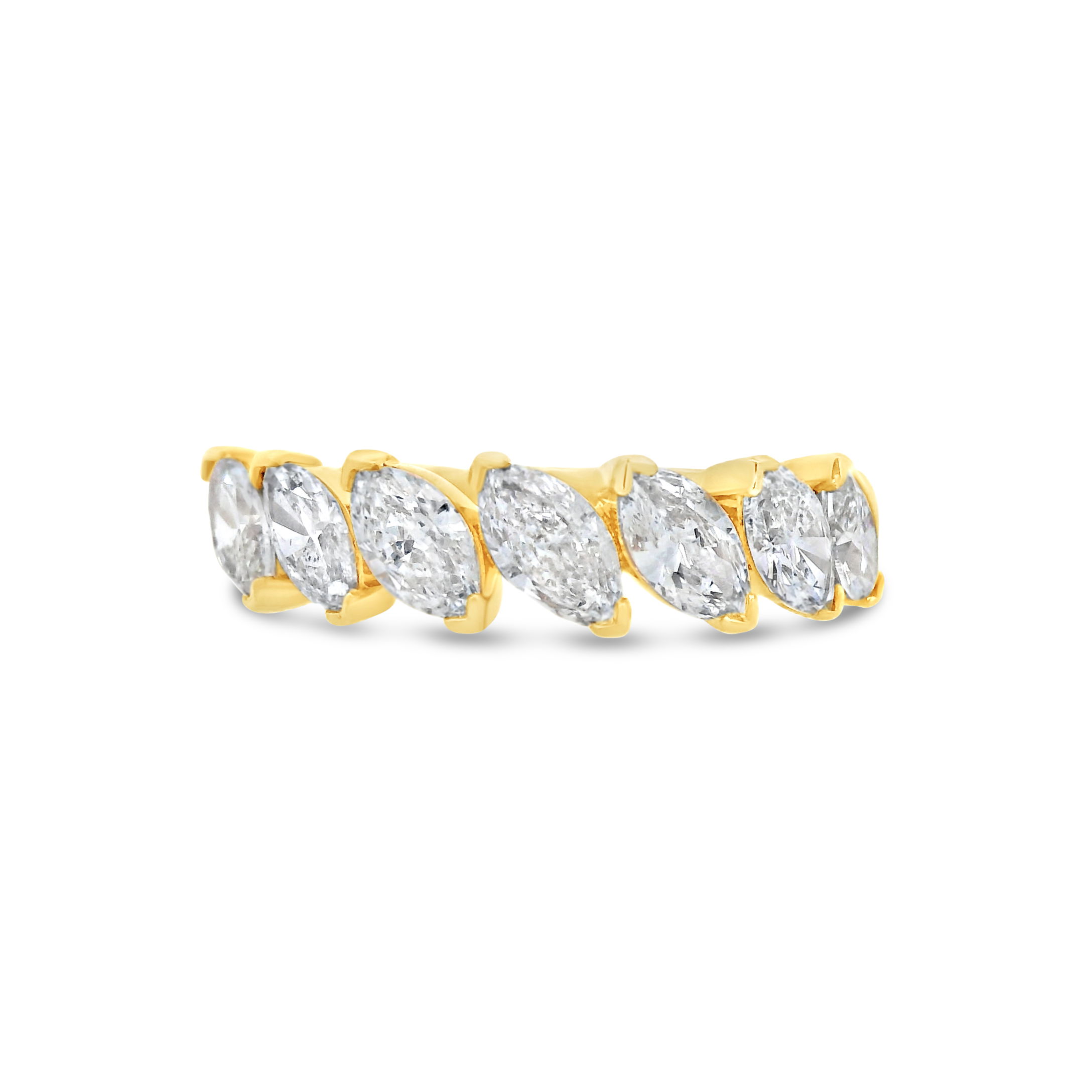 This striking anniversary band features diagonally set marquise diamonds, creating a unique and dynamic design that enhances the sparkle and brilliance of each stone. The bold, contemporary setting adds a sophisticated touch to any bridal set or as a stand alone piece.-18k Yellow gold-Marquise diamonds, 1.34cts-Size 6.5, Contact for sizing optionsItem# 110-2000043 Marquise Anniversary Band