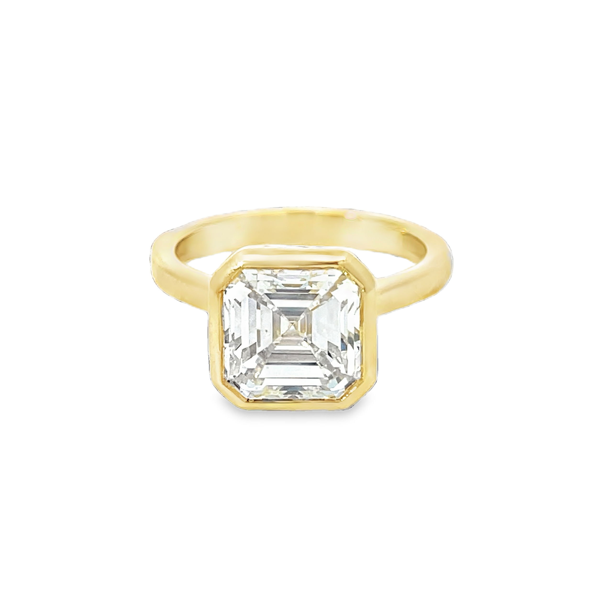 This stunning ring features a dazzling asscher cut diamond at 4.15cts. With fine polished 18K yellow gold, this piece is perfect for both engagement or fashion purposes. -18k Yellow gold-Asscher cut diamond, 4.15ct-Size Item# 100-2000038 Asscher Cut Engagement Ring