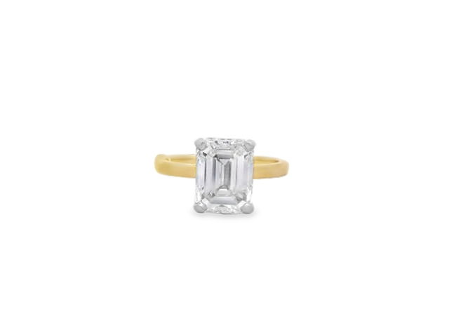 This striking 3.52ct emerald cut diamond solitaire ring is set in 18k Yellow gold and showcases timeless elegance in its purest form. Set in a classic and refined design, the clean lines and step-cut facets of the emerald cut diamond exude sophistication and understated luxury. A bold statement of enduring style.-18k Yellow gold-Emerald cut diamond, 3.52cts-Size 6.5, Contact for sizing optionsItem# 100-2000039 Emerald 3.52ct Solitaire Engagement