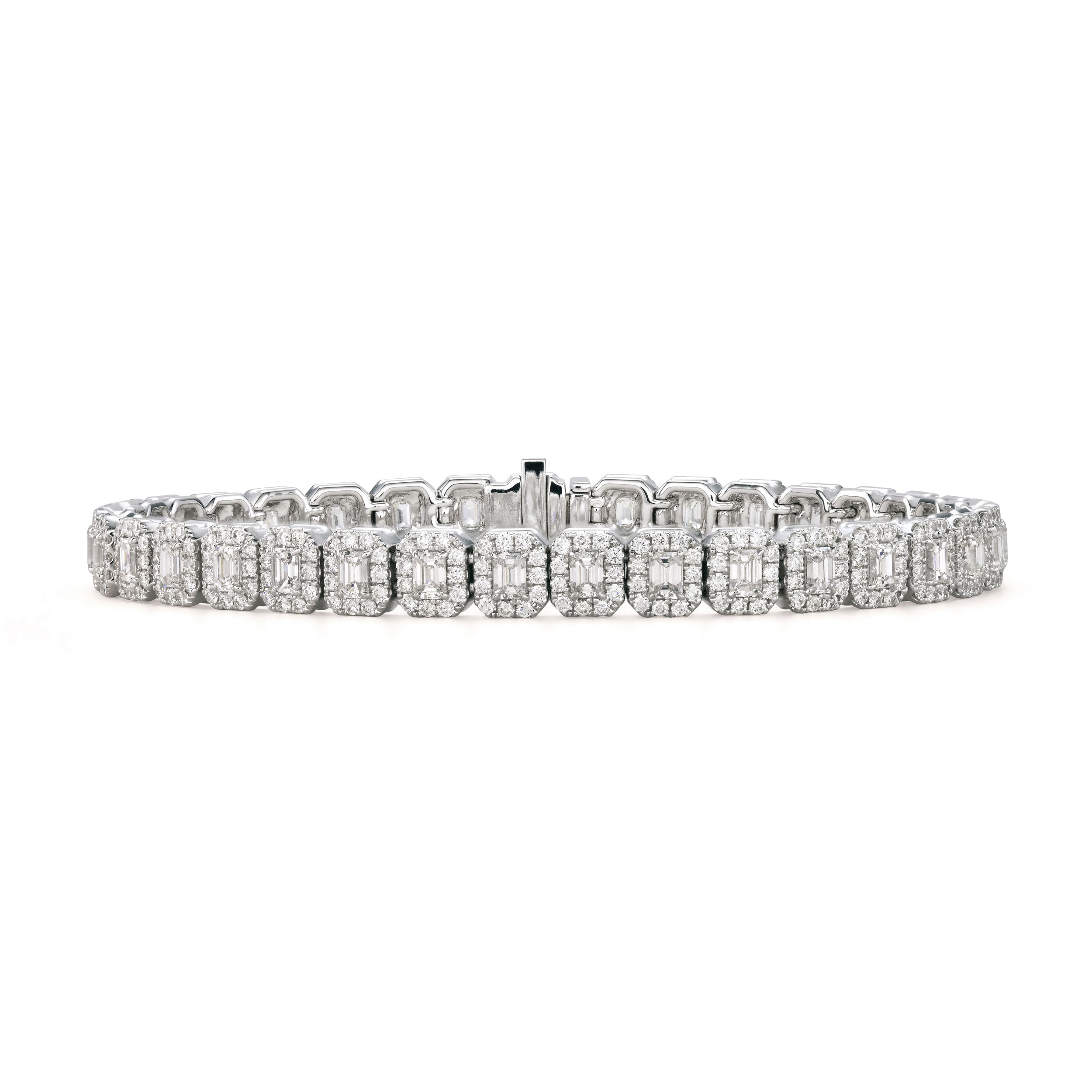 With everlasting sparkles, you are promised to turn heads in this piece. With a simple silhouette, this bracelet is the perfect choice for elevating the look of a little black dress or any wardrobe. -18k White gold-Emerald cut diamonds, 6.02cts-Round diamonds, 2.8cts-Length 7"Item# 170-2000046 Tennis Bracelet With Halos