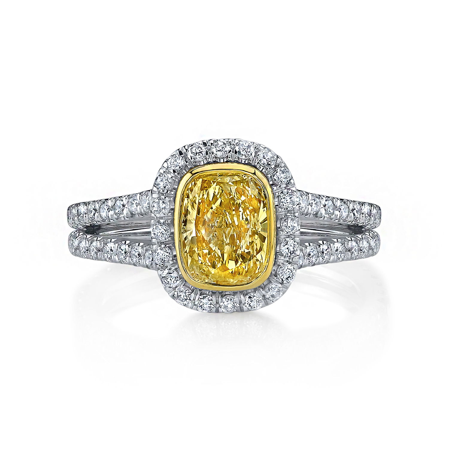 This delicate split shank ring showcases a stunning fancy yellow diamond elegantly micro-paved for maximum sparkle. A piece of true beauty, this one is a must for any enthusiast or collector. -Platinum-18k Yellow Gold-Cushion cut yellow diamond, 2.01cts-Round diamonds, 0.68cts -Size 6.5, Contact for sizing optionsItem# 130-2000041 Yellow Diamond Engagement Ring