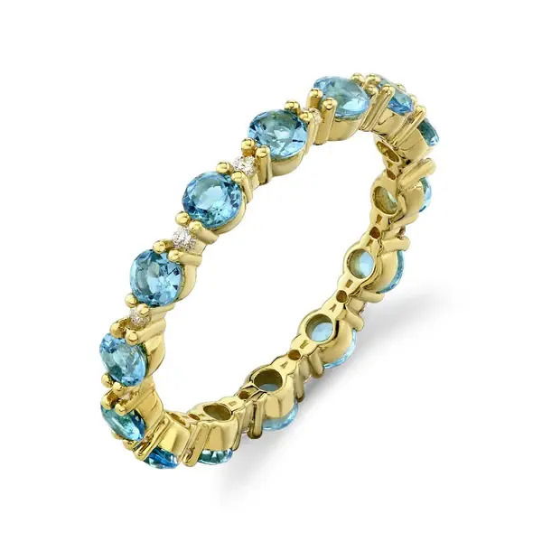 Combining Swiss Blue topaz and diamonds, this ring showcases elegance and modern design in one, allowing itself to become a stunning addition to any collection.-18k Yellow gold-Round diamonds, 0.14cts-Swiss blue topaz, 1.66cts-Size, 7Item# 804-2000288 Swiss Blue Topaz & Diamond Eternity Band