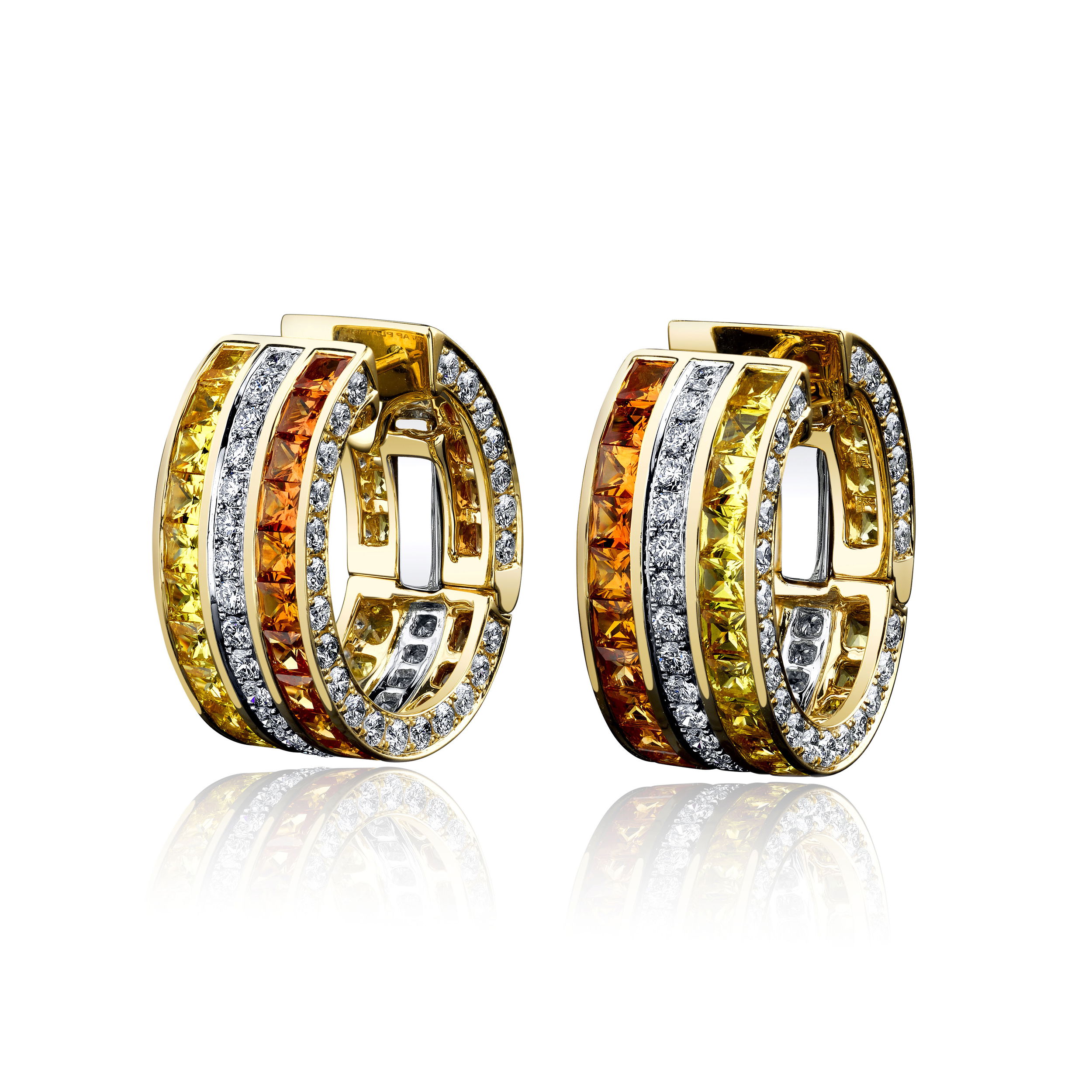 These wide clutch earrings shine with a vibrant mix of princess-cut yellow and orange sapphires, accented by round brilliant diamonds in platinum and 18k yellow gold. Bold yet elegant, they’re the perfect way to add a warm, radiant glow to any look.-Platinum-18k Yellow gold-Princess cut yellow and orange sapphires, 7.44cts-Diamonds, D-F/VS+ 3.07ctsItem# 805-2000477 Yellow & Orange Sapphire Masterpiece Wide Clutch Earrings