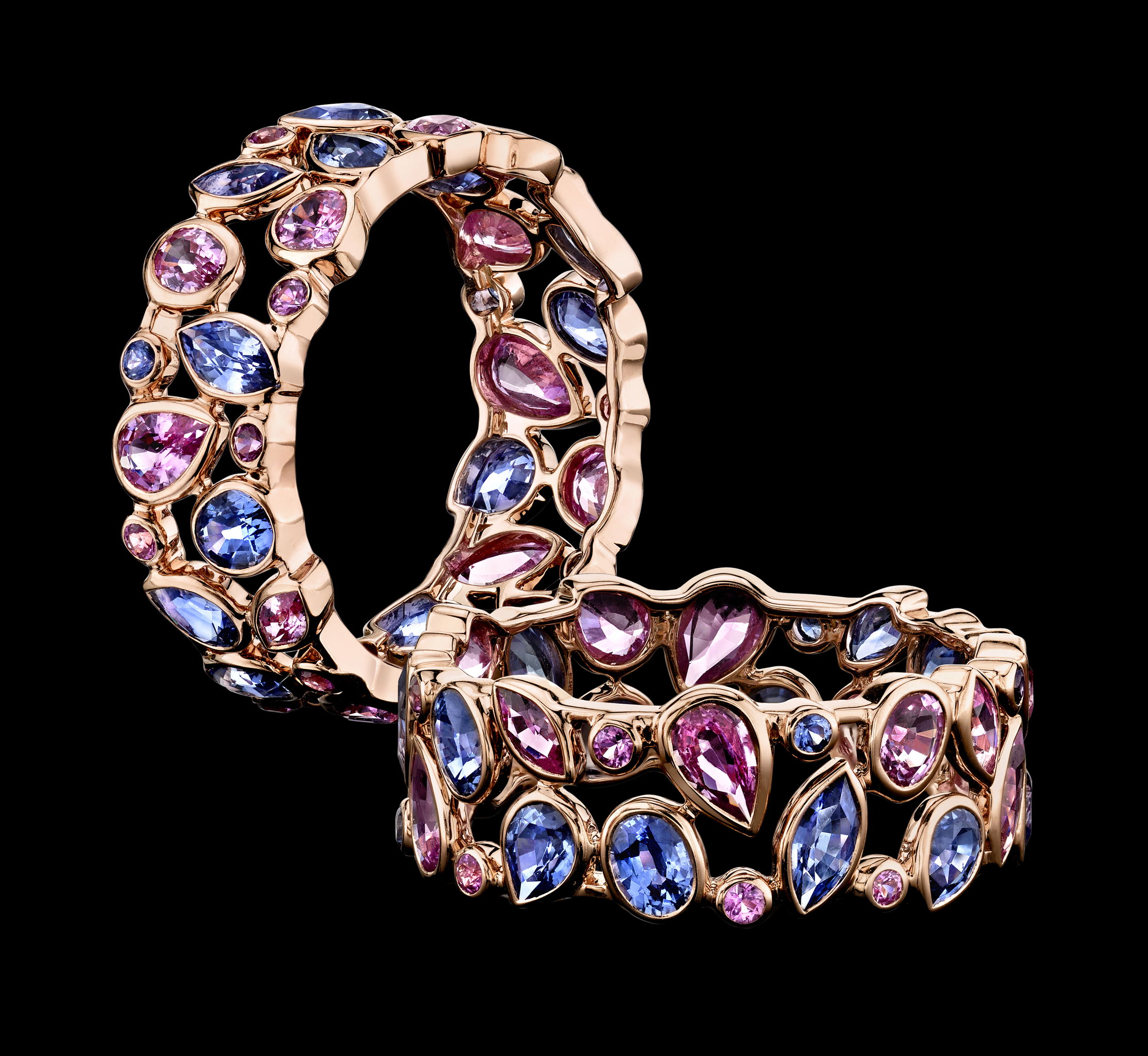 The De La Vie eternity ring shimmers with a delicate mix of light blue and pink sapphires, set in warm rose gold for a soft, romantic glow. A beautiful symbol of love and life's sweetest moments, it’s the perfect ring to cherish forever.-Rose gold-Mixed cut pink sapphire, 2.24cts-Mixed cut blue sapphire, 2.05cts-Size 7Item# 804-2000291 Light Blue and Pink Sapphire De La Vie Eternity Ring