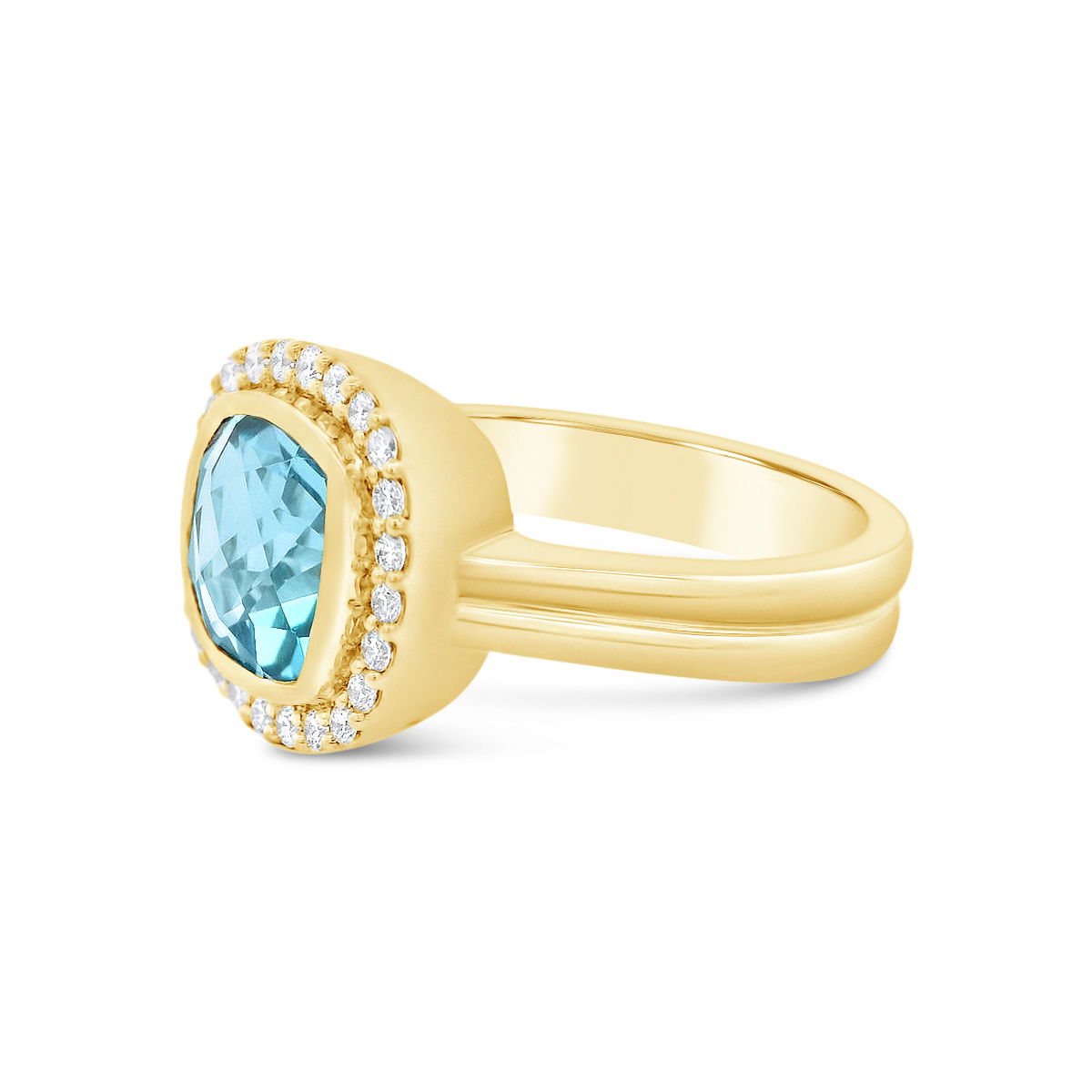 A vibrant Swiss blue topaz sits at the heart of this 18k yellow gold ring, its brilliance enhanced by a shimmering halo of diamonds. Whether worn as a statement piece or an everyday favorite, it brings a bold yet effortless elegance to any look.-18k Yellow gold-Swiss blue topaz-Diamonds, 0.21cts-Size 6.5Item# ND-Ring-00026 Swiss Blue Topaz Ring