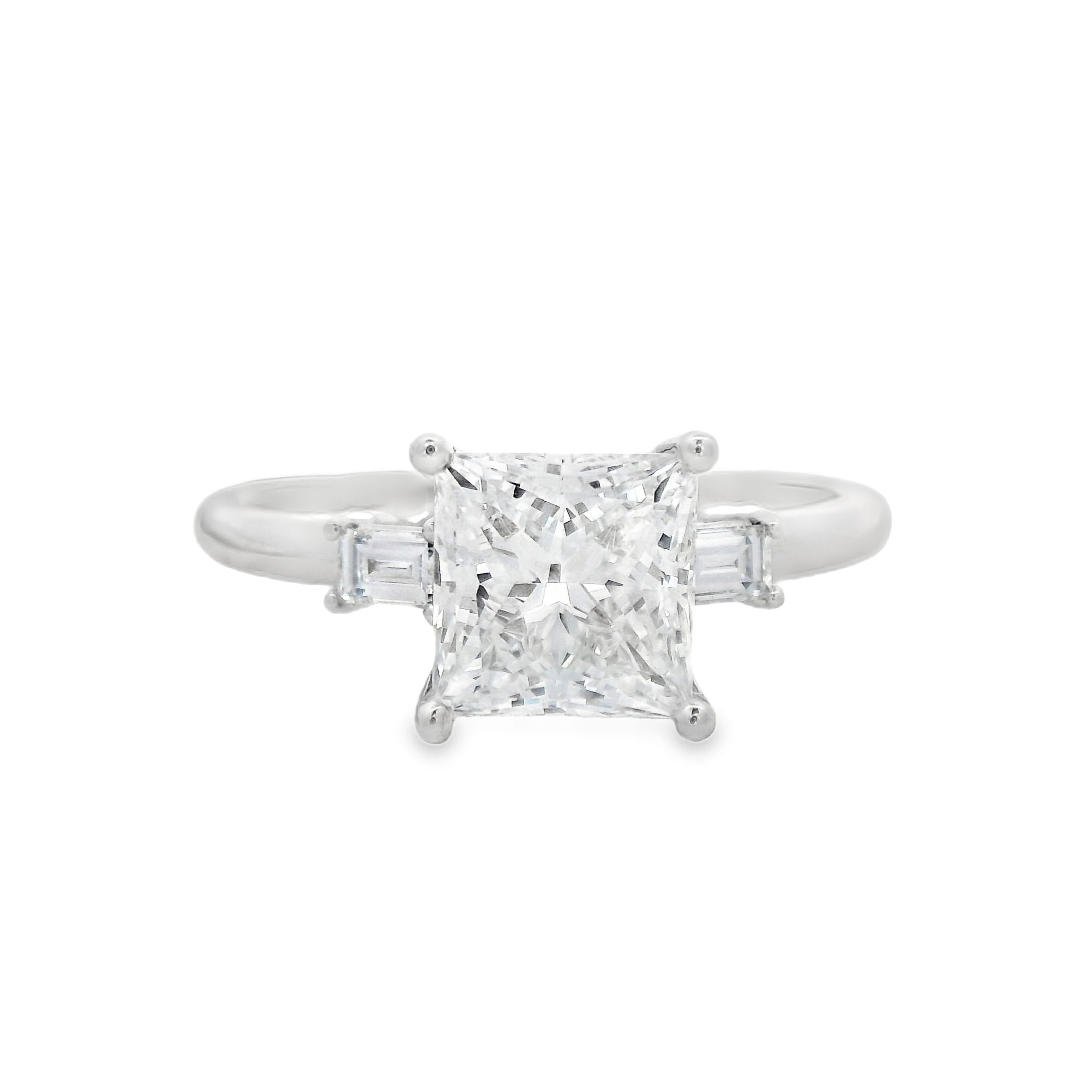 Modern and meaningful, this 14K white gold engagement ring features a lab-grown princess cut center diamond flanked by sleek baguettes. A timeless three-stone design that symbolizes your past, present, and future—crafted with conscious brilliance.-14k White gold-Princess cut lab diamond, 2.04ct-Baguette lab diamonds, 0.18cts-Size 8.75, Contact for sizing optionsItem# 100-2000042 Princess Three-Stone Engagement Ring