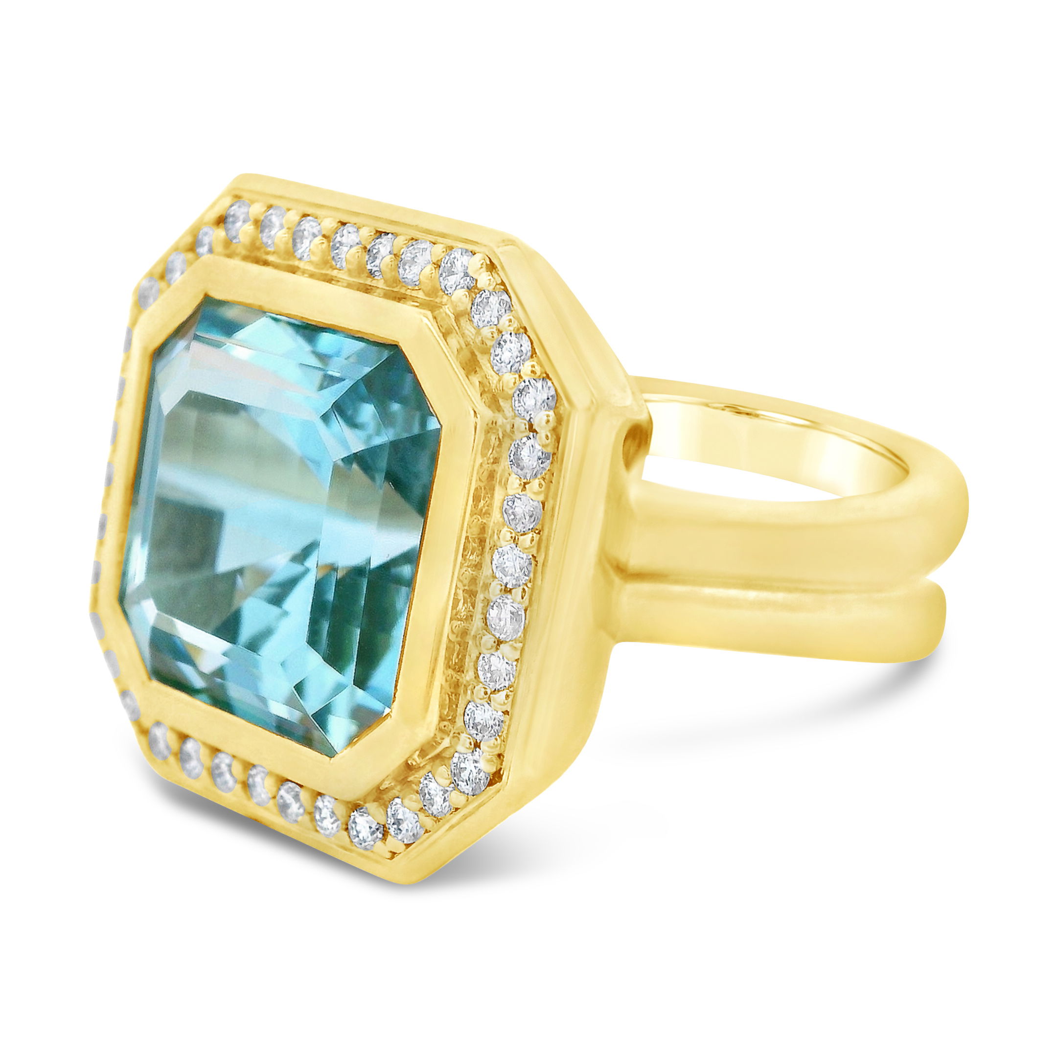 This 18k yellow gold ring, featuring a bold aquamarine surrounded by diamonds, is more than just a stunning statement piece. It brings strength and serenity to every gesture.-18k Yellow gold-Aquamarine, 8.35ct-Diamonds, 0.38cts-Size 7Item# ND-Ring-00028 Octavia Ring