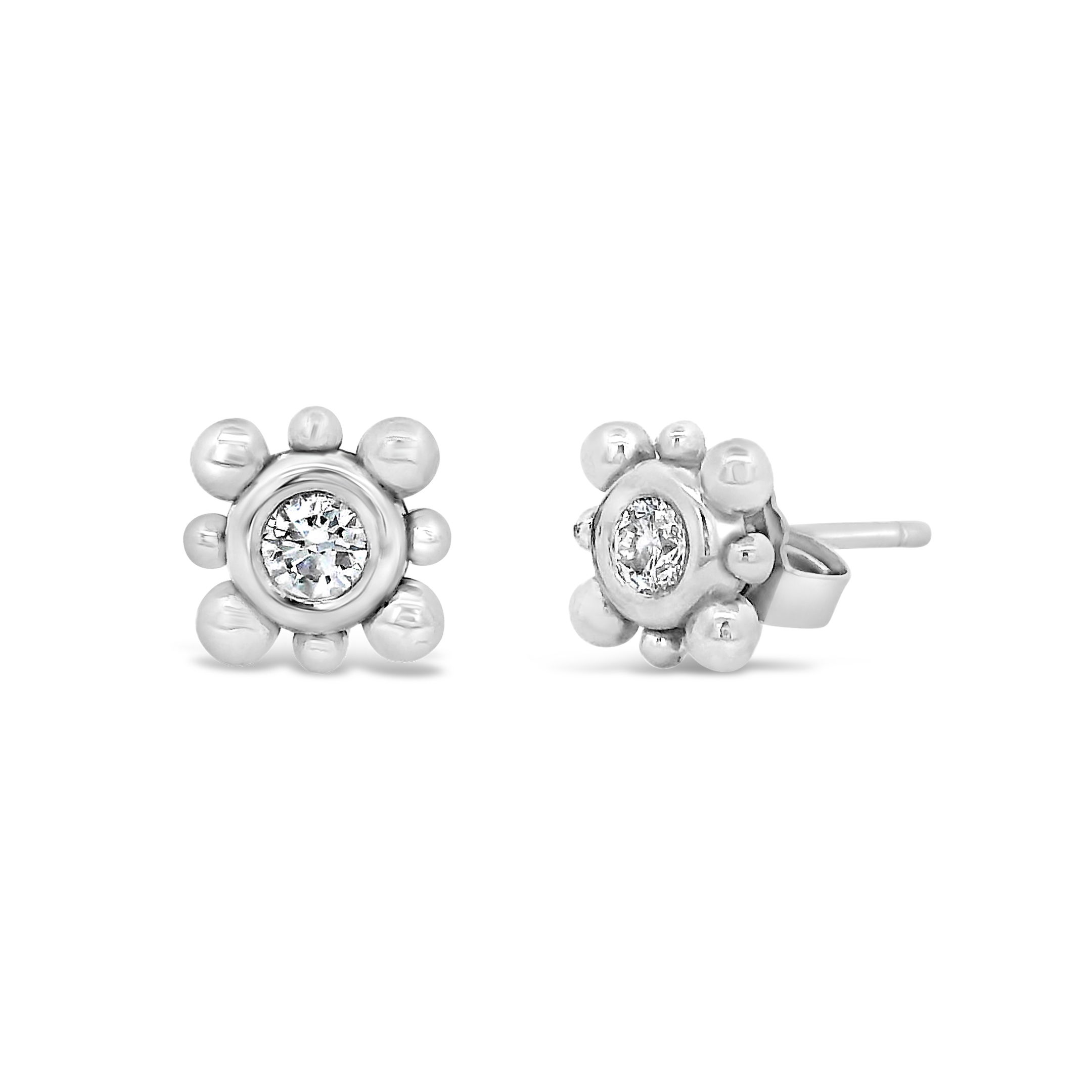 These 14k white gold studs feature diamonds set in a sleek bezel with a delicate ball detail. They’re subtle, stylish, and perfect for everyday wear.-14k White gold-Diamonds, 0.16ctsItem# ND-EAR-00030 Diamond Stud Earrings