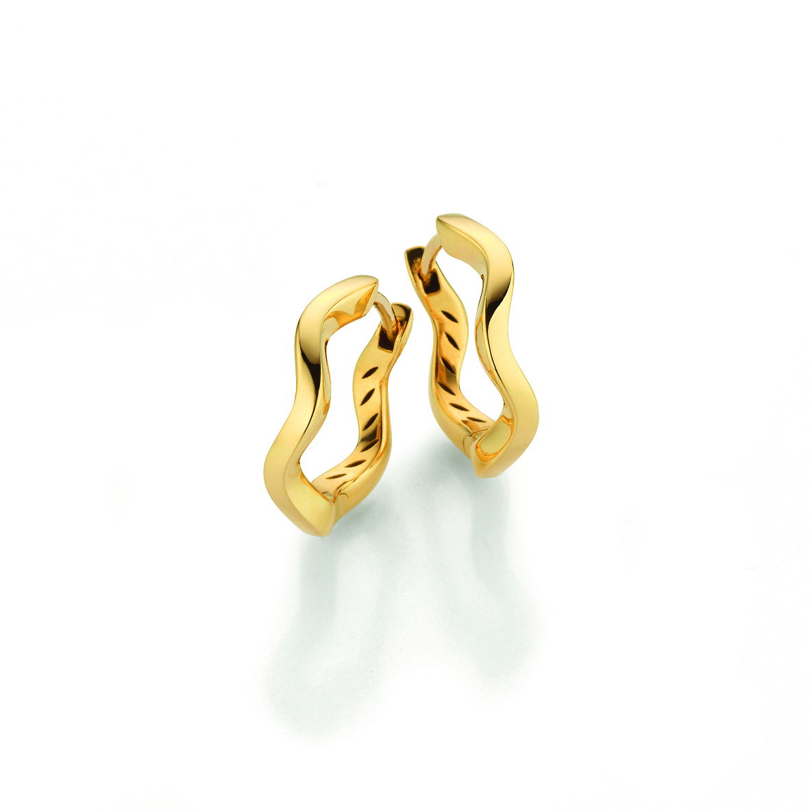 These wavy hoop earrings are crafted in 18k yellow gold, bringing a sculptural twist to a classic silhouette. Lightweight and stylish, they add just the right amount of movement to any look.-18k Yellow goldItem# 805-2000495 Wavy Hoop Earrings