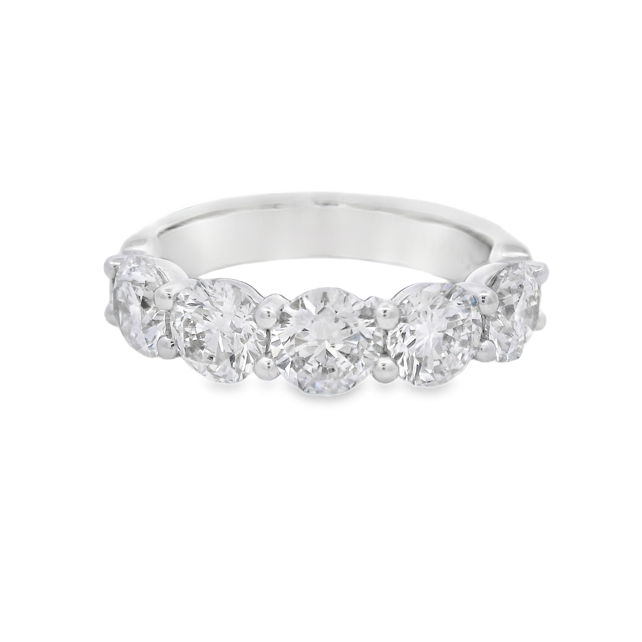 This 18k white gold anniversary band features round diamonds set in a unique "buttercup" setting, enhancing their brilliance with a timeless and elegant design. A perfect way to celebrate your love, this band adds a sophisticated touch to any engagement ring.-18k White gold-Round diamonds, 2.54cts-Size 6, Contact for sizing optionsItem# 130-2000051 Round Buttercup Band